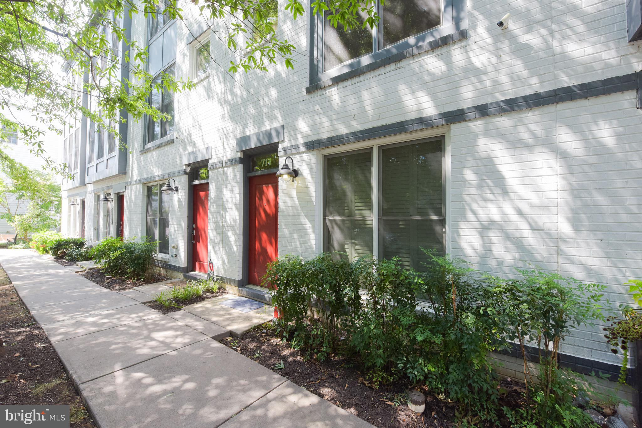 Move in to this turn-key townhouse. Located in the vibrant Northwest quadrant, you will love the easy access to the shops, restaurants and independent businesses of Old Town and Del Ray. Park the car in the 2 car (tandem) garage and take advantage of the extra easy public transportation. Please note, this property is in the popular Naomi L. Brooks Elementary School District.
The open and flexible living space has an easy flow. Hardwood floors, a handsome built-in console and even a wall-mounted, flat screen television make this area ready for prime time. The kitchen is functional and stylish. Timeless subway tile backsplash complements the dark finished lower cabinets and crisp, white uppers. Wrap-around work space features granite topped counters and a handy breakfast bar. Brushed stainless steel appliances include a gas cook-top, electric oven and recent microwave oven, Bosch dishwasher and Whirlpool side-by-side refrigerator. A small west facing deck offers a gas grill (plumbed to house) There is also a full sized powder room on this level.
There are three upper level bedrooms, each with an ensuite bath and ample closet space. The top quality LG washer and dryer are conveniently located on the bedroom level along with a handy linen closet. The top floor is home to Bedroom #3 and its full bath, as well as a light-filled, bonus room, perfect as a work-from -home space, airy getaway or the ideal set-up for a private guest area.
Take advantage of the change of seasons and tree top views from the roof deck (with retractable awning). More things to love.. the first floor entry has ceramic tiled floors, a coat closet and easy access to the two car (tandem) garage. Don't miss the additional, easily accessed garage storage. HOA includes twice weekly trash collection and once weekly recycling pick-up. No smoking on premises.