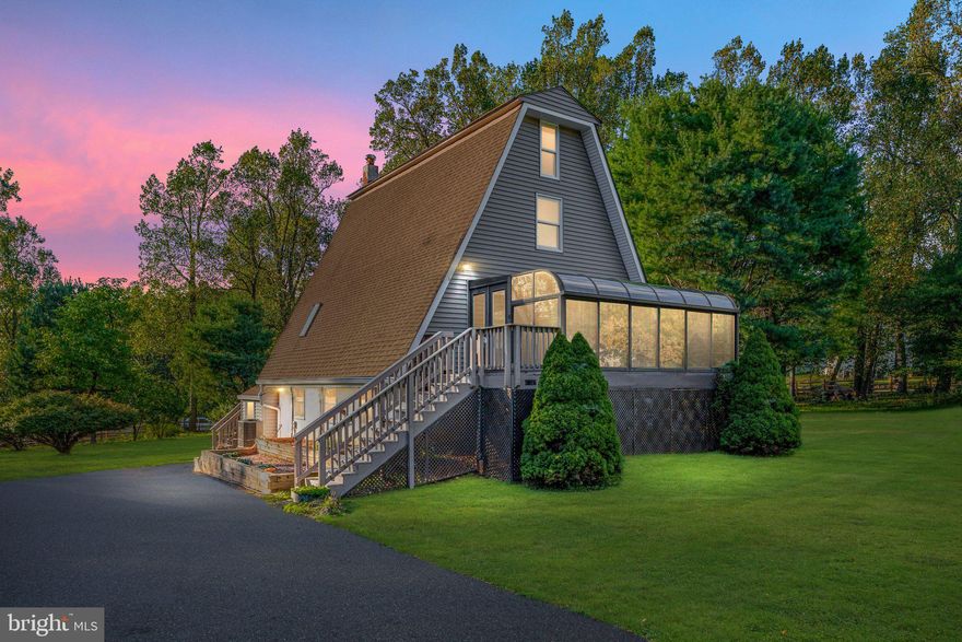 PLEASE NOTE PROPERTY IS IN BLUEMONT WV NOT HARPERS FERRY. We had issues with showing time and MLS with the original zip code including both WV and VA. Actual address is 17185 
Hays Dr. Bluemont, WV, 20135.  Discover the perfect blend of charm and comfort in this inviting property nestled on a serene 1-acre lot offering seclusion and space for outdoor activities. Features include A-Frame architecture, added bathroom on the upper level,  large detached garage, and plenty of storage space in the lower level.  Sit back and relax in the sun-soaked charming sunroom, perfect for enjoying every season. Enjoy the scenic 15-minute drive to the vibrant town of Purcellville. You will always find something to do with the proximity to local attractions, wineries, breweries, community events,  hiking trails, and other outdoor activities. Major renovations in the kitchen, bathroom on the main level, and entire upper level were done in 2021. Water heater replaced within the last year. Sun room was just recently waterproofed and deck freshly painted. Newer wood flooring added on the main and upper levels. New refrigerator added in the kitchen. Property has a permanent back-up generator and water softener system installed. Don't miss your chance to own this one of a kind well-maintained home!