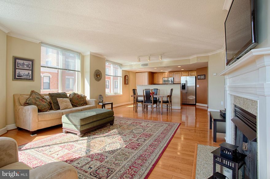 OPEN SUN 4/24, 1-4p. Heart of Clarendon! Great views: CORNER/TOP floor w/1300+ sq ft. Open Kitchen: Stainless Appliances, Gas Cooking, Granite Counters+Breakfast Bar. Hardwoods. Gas FP. Walls of windows- wonderful, open Living & Dining Room w/amazing light. 2 Master BR Suites w/Walk-in Closets. 2 Res Garage Spots. Sep Storage Unit. Washer+Dryer. Great amenities: Pool, Comm Rm, Secure bldg. Pets OK