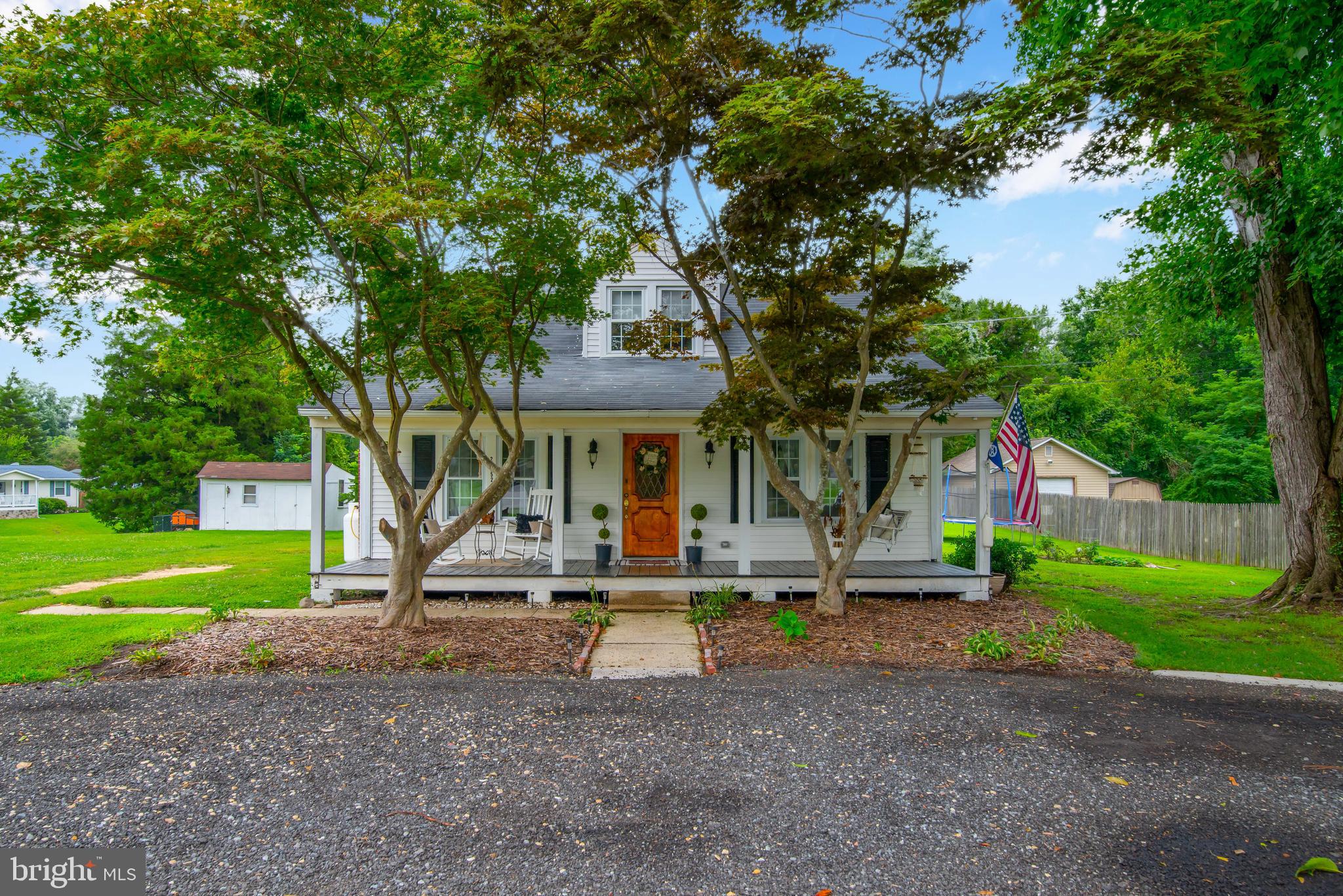Sellers are moving South and are ready to sell.....Charming! This beautiful Cape Cod has tons of character and is waiting you! This home has been lovingly remodeled and is loaded with designer touches. The front porch of this home invites you to have a glass of cold lemonade while you relax and unwind on a warm summer evening. When you go inside as evening approaches, you will find a cozy living room, filled with soft light coming in through the windows, and a beautiful fireplace, perfect for the cooler autumn evenings. Luxury, easy care laminate flooring gives you peace of mind, for year after year, it will wear beautifully. The kitchen is a dream come true. It is fully remodeled. The cabinetry and hardware is simply gorgeous. There is a stunning kitchen island that will host all your intimate gatherings with friends and family. Conveniently located off the kitchen is a room that can be a playroom for the kiddos, or an at-home office for you. You will also discover a beautifully remodeled full bath. A spacious laundry room with a sliding glass door that leads to the backyard yard is also found on the first level. As the day winds down and you are ready for sleep, you will delight in a first level primary bedroom and bath. The bedroom is large, with ample closet space. The bath is everything you could imagine. There are designer double bowl sinks, and a beautiful tiled shower. When you go to the staircase, you will will notice the charming designer touches on the stairway. Upstairs, you will discover two well appointed bedrooms, just perfect for children, or guest rooms. Outside, the home also has a large storage building in the backyard. Bonus!!! No HOA! This home is located in a water access community, so bring your boat! There is a community pool for your summertime fun. This gorgeous home won't last long! Being sold AS IS, priced to sell and instant equity!! Don't let this one slip through your hands!!