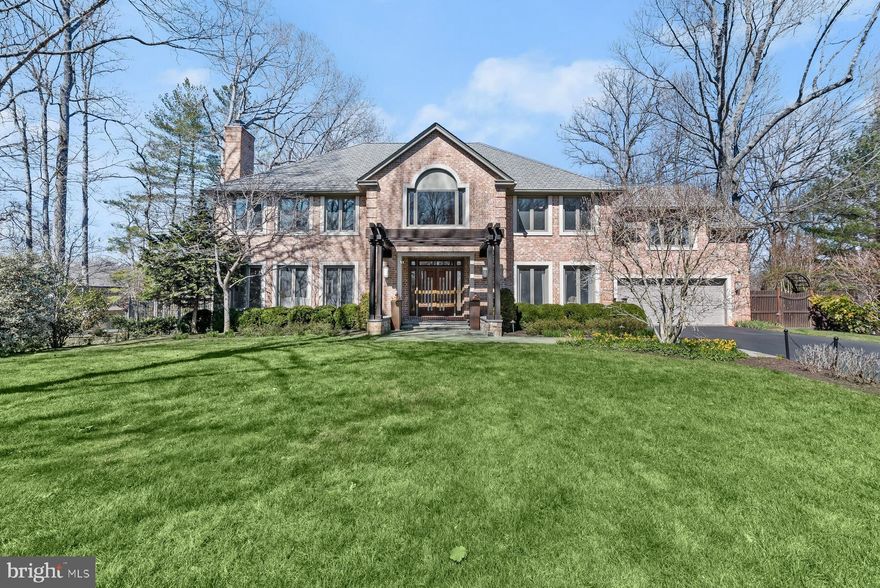 Ideally appointed on nearly an acre in the prestigious Glen Mill Village neighborhood, 11820 Beekman Place boasts a seamless blend of timeless design and modern living spaces throughout 4 Bedrooms, 5.5 Bathrooms and 6,854 total square feet. Residents approach the property along a meticulously maintained and spacious front yard, lined with soaring mature trees, as they enter the home through its pergola covered front. Double entry doors open to the breathtaking 2-story Foyer, complete with modern chandelier and grand staircase, creating a warm welcome to the home’s light-filled interiors. Flanking the entry Foyer, a home Office showcases ageless charm with oversized windows, built-ins and custom moldings, introducing the impeccable details spanning throughout the 3 level residence. High ceilings, recessed lighting and glass paneled doors continue into the connected Living and Dining rooms, with glistening hardwood floors and a marble-covered fireplace. The Gourmet Kitchen with a center island displays contemporary flair in the peninsula breakfast bar, granite counters and modern Stainless-Steel appliances including a 5-burner cooktop, range hood, and built-in microwave. The connected Family Room maintains the home’s brightness through a wall of windows and multiple skylights, offering built-ins, a wet bar, gas fireplace and sliding glass door to the rear patio, creating a gracious flow for indoor to outdoor living. A Powder Room and Laundry/Mud Room complete the amenities offered on the Main Level. By way of the grand staircase, the expansive Primary Suite presents a double door entry and features a fully outfitted walk-in closet and an attached Sitting Room for ultimate privacy and comfort. The fully renovated, spa-like Primary Bathroom is complete with dual vanity, quartz countertops, skylights and an oversized walk-in shower. The sprawling Upper Level guest quarters include 3 additional en-suite, commodious Bedrooms. The multifunctional and finished, walkout Lower Level offers flexible living spaces including a Recreation Room with gas fireplace, wet bar, Gym, and additional Guest Room and Full Bathroom. The residence’s exterior amenities are as wonderful as its interiors. Offering an idyllic setting for al fresco dining and entertaining, the home is complete with a stunning rear Patio, Outdoor Kitchen with Viking Grill and Beverage Refrigerator, Flagstone Patio perfect for Dining and an expansive, heated, in ground Pool with separate Hot Tub. An attached 2-Car Garage completes this home’s abundant offerings.