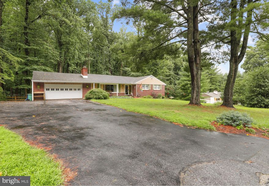 This amazing home is back on the market due to the buyer financing falling through!
Spacious, fully renovated rancher with over 2700 sq ft of finished living space sitting on 1.3 acres! Large front yard with covered porch perfect for morning coffee. The main level boasts elegant touches throughout. Hardwood flooring, wainscotting, built in bookshelves and a large picture window create an inviting atmosphere in the living room.

The kitchen and dining room have a walk out to the large deck that overlooks the huge backyard with mature trees covering 1.3 acres! The kitchen features granite countertops, stainless steel appliances and a breakfast bar with window overlooking the backyard.

The main level features 3 bedrooms and 2 full bathrooms. The primary bedroom features a private en suite bathroom with custom tile and a beautiful walk in shower. The lower level has a fourth bedroom with full bathroom and two large areas perfect for a home movie theater and game room with a pellet stove! There is also a walk out to the backyard and patio as well as  a laundry room. The lower level also has a section for storage, perfect for organizing all your odds and ends.

The deck runs almost the length of the back of the house and has a built-in grilling station! Enjoy summer nights watching the fireflies from the back deck or exploring the mature wooded area. The trees right off the deck are the perfect width apart to hang a few hammocks! There are also two patio sections off the deck perfect for entertaining and a fire pit.

Plenty of space for parking with a two car garage and oversized driveway. The garage has been updated with additional storage space in the rafters as well as a new workbench.
The electric panel, septic and well system have been recently updated!