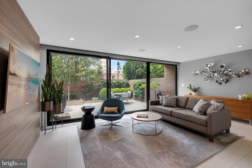 This I.M. Pei pristine residence, is the best example you will find of mid-century modern design, blending urban convenience with elegant living spaces. For those seeking a sophisticated lifestyle IN THE HEART OF SOCIETY HILL, you have found the perfect home.
Upon entering, you will encounter a stylish and cleanly designed space. Featuring MASSIVE HEATED TILE FLOORS, perfect for entertaining. The Poggenpohl chef's kitchen is equipped with MIELE appliances and fantastic counter space. And an easy flow into the dining area! The living area extends seamlessly to an ELEGANT GARDEN, ideal for outdoor living, and an extension of your living space six months of the year. Also, off of the garden is your PERSONAL PARKING SPACE.
 A wide staircase leads to the relaxation level, with an abundance of custom walnut millwork by the finest craftsmen in the area: featuring an inviting den with a gas FIREPLACE, a media room that could be converted into a fourth bedroom, and a full bath. The top floor is filled with ABUNDANT SUNLIGHT and includes a gracious PRIMARY SUITE offering views of the Ben Franklin Bridge, a magnificent custom bath, and perfect closet space. There are also two additional bedrooms and another stunning bath on this level.
The basement, with great ceiling height, is ideal for storage, enhancing the seamless practicality of this home.
Situated in Society Hill, and on one of the most sought after blocks, you will just love living minutes from the City's best dinning and cultural activities, as well minutes from Jefferson, Pennsylvania and Cooper Hospitals.