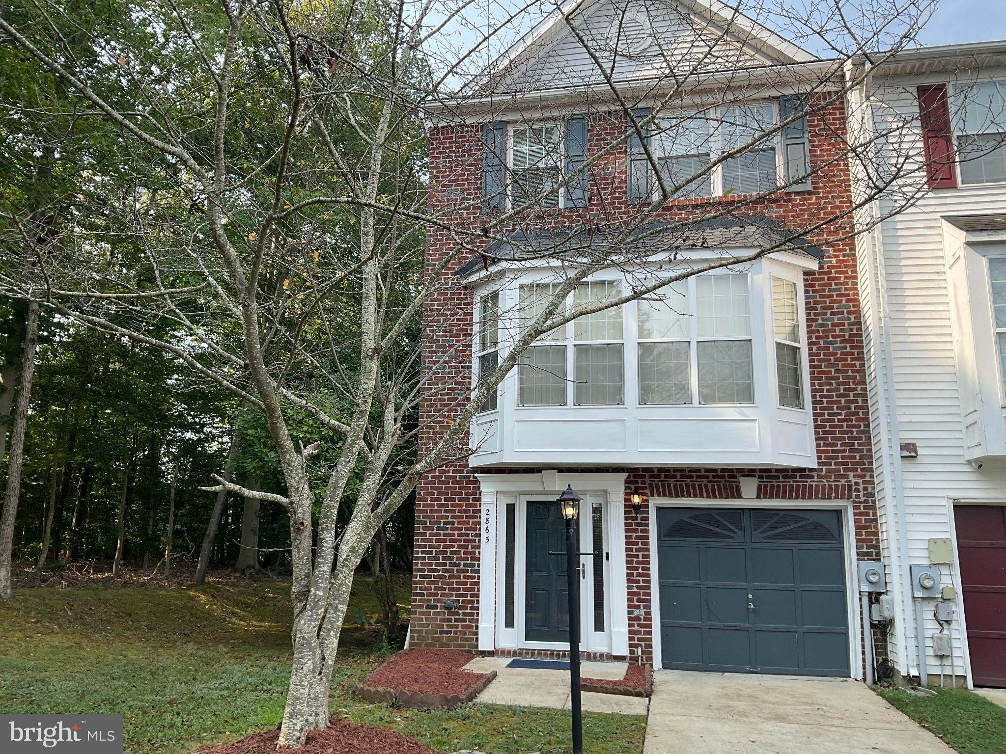 Welcome to 2865 Waters Edge Ct., this beautiful, well maintained, custom designed end unit townhouse tucked away in the quiet suburban neighborhood of Bryan's Road. The seller has meticulously added custom flooring, closets and decor. Hardwood floors with brilliant designs, bay windows with lots of natural light. Gorgeous home decor and light fixtures, fireplaces on both the first and second levels offering cozy family and entertainment areas. The home offers 3 bedrooms, (one professionally converted to a walk in closet) two full baths and 2 half baths, master includes a soaking tub. The home includes a two-level double deck for plenty of outside family and friends time with treelined coverage for shady fun events. Upgrades include brand new roof, freshly painted bay windows and power washed (2025), newer HVAC system and water heater (2021), Dishwasher (2022)