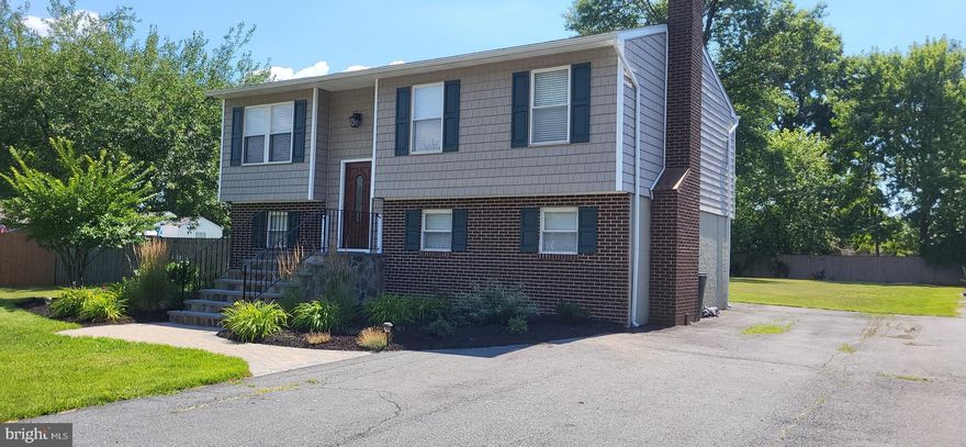 Welcome to fabulous Cloverfields, the ONLY community on Kent Island that offers a beautiful sandy beach, gazebo, boat ramp, marina, over sized pool, pool house,  clubhouse, and playground! This modernized split foyer is perfectly situated in the heart of the community.  Featuring hardwood floors, granite counters, brand new appliance package in the kitchen includes dishwasher, range and refrigerator. Remodeled baths and vanities. Large covered deck off the second floor allows for entertaining in the summer fun while the enclosed patio below allows for extra year round space.  The large L shaped  living room boast a wood burning fireplace with new vinyl plank flooring.  Brand new carpet on the 2nd floor and paint throughout. Bonus room on ground floor could be 4th bed or office.  Large separate laundry room with ample space for storage. Fresh landscaping out front and large back yard with shed for all the gardening needs. HVAC replaced 5 years ago.