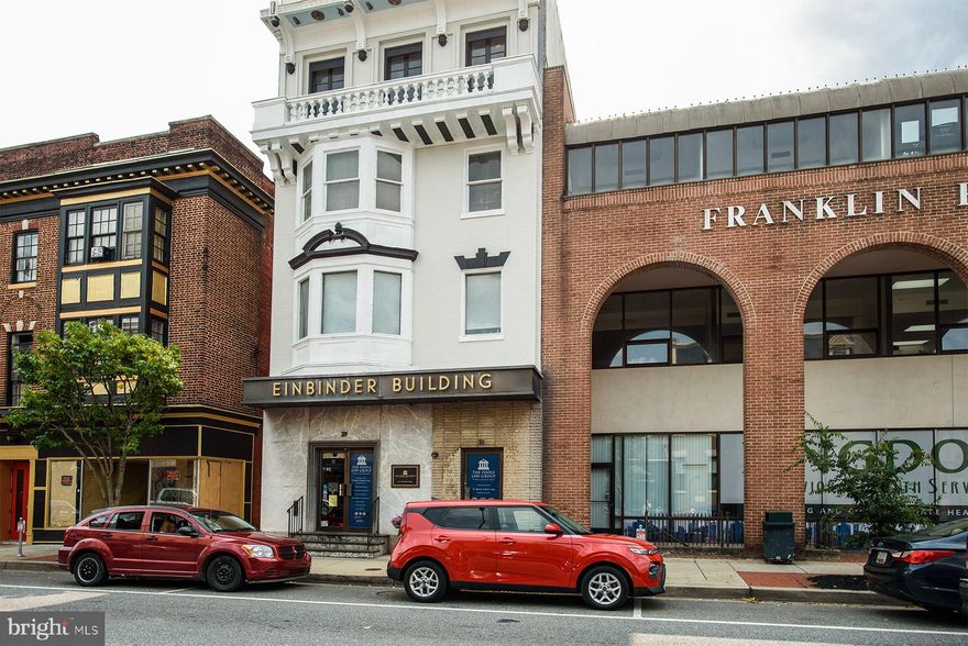 Outstanding Investment Opportunity in Downtown Hagerstown!  Pride of ownership shows in this extremely well-maintained commercial building, known locally as the Einbinder Building. Offering over 8,600 sq. ft. of usable space across four stories plus a finished basement, this property is perfectly suited for a variety of uses under its CC-MU (City Center Mixed Use) zoning.  The building features two main entrances: one leading to a spacious first-floor office suite with multiple private offices and a large conference room, and another providing direct access to six upper-level units with income-producing residential potential on upper floors, also includes a functional fire escape. The finished basement adds additional office space, utility areas, and a walkout to the rear.  A rare bonus in the downtown market, the property includes a private rear parking lot with multi-alley access, accommodating 8 vehicles with potential for expansion.  Conveniently located just steps from the U.S. Post Office, Hagerstown City Hall, courthouses, Meritus Baseball Stadium, local businesses, and restaurants, with easy access to both I-81 and I-70, this building combines an unbeatable location with flexible functionality.  Don’t miss this exceptional chance to invest in the heart of Hagerstown’s growing downtown district!