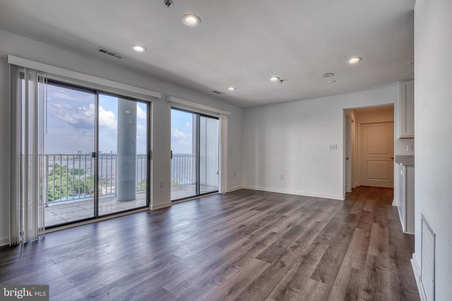 Rarely available renovated 3 bedroom  2 bath unit in Lighthouse Point with unbeatable  WATER VIEWS!! Hardwood floors throughout, all new stainless steel appliances, quartz countertops and wide open floor plan with tons of natural light. Large master bedroom with views of the harbor, attached master bathroom with top of the line finishes, including a double vanity and new shower. Two other spacious bedrooms both have views of the harbor and the third bedroom features a massive walk in closet. The second bathroom has a brand new tub/shower and vanity. Building has 24-hr security, attached garage parking (2 spots) 2 Fitness Centers  in the building and you are just steps from the beautiful run/walk path along the harbor. Easy access to grocery stores, restaurants, cafes and easy on/off for 95N, 95S and 895! Don't miss this one!!