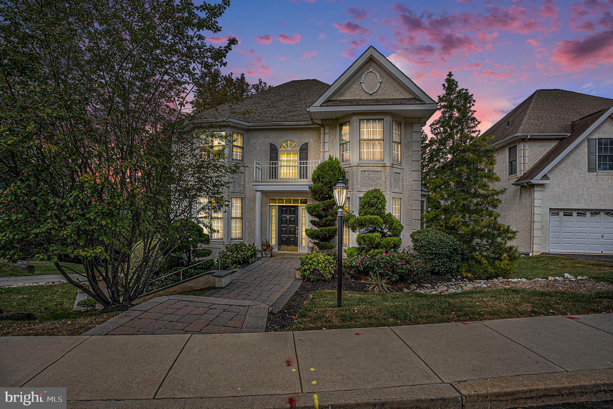 1018 Riverview Lane is a stately center hall Colonial that sits high in the Merion Hills subdivision. This property is luxurious, including many builder upgrades, located just minutes from the 476 & 76 interchange, Conshohocken train station and is in Upper Merion school district.
You will be greeted by a vaulted foyer with hardwood floors when you enter, with elegant columns separating the formal living room on the right and the formal dining room on the left. A curved staircase winds its way to the second level. The foyer, dining room and formal living room feature exquisite crown molding and trim throughout and bay windows. Truly a beautiful space to entertain.
From the dining room there’s a butler’s pantry that connects to the large gourmet kitchen. This kitchen has ample granite counter space and cabinet space in a warm cherry. The flooring is high quality, neutral tile. Appliances include a gas stove top, double stainless-steel ovens, a large stainless-steel refrigerator and a dishwasher. You can eat at either your expansive breakfast bar or the sunny breakfast nook with a bay window. Ideal for making amazing meals and memories with loved ones.
Across from the kitchen is the family room featuring a gas fireplace and plenty of natural light and glass doors to the elevated deck.
The elevated deck offers both privacy and a place to enjoy the outdoors. During the warmer months mature trees provide both shade and seclusion.
The primary level also has a half bath and an elevator that services all three levels of the home.
Upstairs the landing and common areas have been updated with composite vinyl flooring.
To the left is the expansive primary suite with tray ceilings, dual walk-in closets, a sitting area and primary bath. The primary bath has two separate vanities, a soaking tub, a shower stall and a private toilet area.
The second floor has two additional, sizeable bedrooms and a second full bathroom.
The basement/lower level is fully finished and features a fourth bedroom and third full bath. This level also includes two additional rooms, one which opens to the lower level deck, and is attached to the garage. This could easily be used as a suite for a family member or au pair.
The lot is maintained by the HOA as is snow removal.