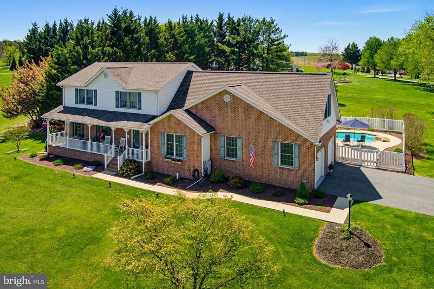 Welcome to 495 Hattie Drive! A beautiful 4-bed, 3.5-bath colonial-style home surrounded by preserved land. With a well-maintained in-ground pool with extensive hardscaping, a large deck, a 2-car garage, and 1.3 acres of land, this home is a sought-after opportunity. 

The main floor has a traditional layout with a neutral design and timeless details. Starting in the foyer and leading through the French doors to the living room on the left. The large living room is filled with natural light filtering from the front-facing windows, creating a warm and inviting space for family and guests. Flowing through the living room and into the dining room, the same warm feel is enhanced by the large bay window and creates a great place for serving and entertaining between lounging and the kitchen. 

The vast kitchen is the focal point of the main floor, showcasing granite counters, an island for added efficiency, and premium appliances like the integrated cooktop and the double wall oven. Serving as another gathering space with a breakfast nook and direct access to the back deck overlooking the in-ground pool. This area serves as a great transition between daily living and entertaining at home. 

Heading upstairs, you will find all 4 spacious bedrooms, each with plenty of living space and perks of its own. The primary bedroom features a large open living area with a spa - like attached bathroom and a vast walk-in closet. The bathroom showcases a large jetted soaking tub and a walk-in shower, highlighted by the skylight above, creating a bright and serene, spa-like en-suite retreat. Down the hall, passing 2 more spacious bedrooms, one with its own walk-in closet, you’ll reach the final bedroom. A large space with vaulted ceilings, 2 large walk-in closets, and a double-wide window that lets in lots of light. 

The lower level has an expansive, finished open area fit for the whole family. This space could serve as a large entertainment space, rec room, hobby area, and many more. A full bathroom with a walk-in shower could also give the opportunity for another living space, with a separate outdoor entrance. Finishing off the lower level is the utility room, where you will find the laundry area, plenty of storage space, and a workshop area to fit your needs. 

Outdoors is where this home shines. The rear of the home has been sculpted to an outdoor oasis with an inground pool, fully fenced in and paved around. The pool is built for the family, with a shallow and deep end, as well as a custom diving rock. The deck overlooks the pool area and connects right to the heart of the main floor. The property expands even further with a vast front and back yard, wide open for yard games and gatherings. 

The attached 2-car garage with a fully paved driveway gives plenty of room for vehicles and storage, and creates another access point inside the home for ease and convenience. This home makes day-to-day living a breeze with all the amenities in between. 

Located in the heart of Hampstead, this home offers convenient access to everyday essentials and local favorites. Enjoy outdoor recreation at Leister Park or spend warm summer days at Cascade Lake. Nearby shopping at Hampstead Marketplace and dining at Greenmount Station enhance the lifestyle, offering the perfect blend of small-town charm and everyday convenience.

Don’t miss the chance to take a look at this beautifully maintained colonial and make it your own!