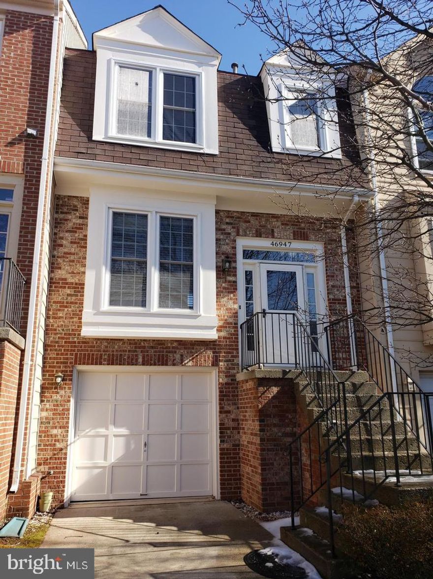 Beautiful 3 bedroom/2 bath classic brick colonial townhome in sought after Fox Village.  One car garage, huge living room with 2 story ceilings, fireplace, fully fenced yard with deck off  main level.  Large kitchen with eat-in table space.  Finished lower level walks out to patio.  A MUST SEE!