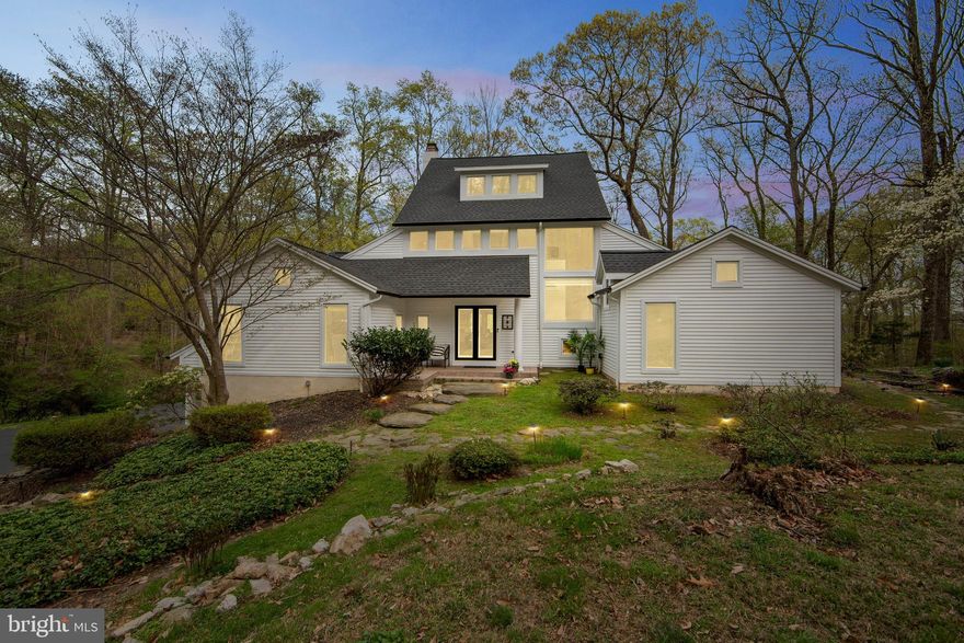 Welcome to Valley Forge Mountain—an enclave of architecturally distinctive homes nestled in a breathtaking natural setting, located within the award-winning Tredyffrin-Easttown School District.
This custom-built, three-story contemporary residence offers 4/5 bedrooms, 4.5 bathrooms, and over 5000+ square feet of finished living space, on 2.3 private acres that blend modern design with the serenity of nature.
Approaching the home via a long circular driveway, this stunning home comes into view— A dramatic double-door entry welcomes you into a three-story foyer with soaring vaulted ceilings and floor-to-ceiling windows, immediately immersing you in panoramic views and natural light.
The main level boasts an expansive open-concept floor plan where the Foyer, Family Room, Office, Living Room, Dining Area, and Kitchen flow effortlessly together. Walls of glass windows flood the interiors with sunlight, while a dual-sided gas fireplace offers a connection between the Family Room and Living Room. The Living  Room also features custom handmade wall sconces, a charming Juliet balcony, and vaulted ceilings that elevate the sense of space. The large Family Room with built ins, opens onto a large deck which overlooks the majestic grounds.
The Kitchen is a showpiece, offering sleek contemporary cabinetry, a unique center island, stainless steel appliances, and abundant counter space—ideal for casual meals or entertaining. for a crowd.   Adjacent to the Kitchen, the Dining Area features a large custom built-in buffet.
A spacious Office with built-ins and expansive windows includes an attached full bathroom, making it easily convertible into a fifth bedroom,  guest suite, or playroom. Also on the main level are two well-sized bedrooms, a full hall bath, a stylish powder room, a laundry room, a chef’s pantry, and access to a stone patio featuring a tranquil koi pond—perfect for outdoor relaxation and gatherings.
Ascend the custom staircase to the second level and enter the luxurious Primary Suite, which includes a loft-style sitting area that overlooks the dramatic foyer below. Vaulted ceilings, recessed lighting, a ceiling fan, and breathtaking views through floor-to-ceiling windows create an atmosphere of calm and retreat. The en suite Primary Bath offers double vessel sinks, a jetted soaking tub, private toilet room and a separate walk-in shower. Two walk-in closets provide ample storage—one of which includes a dressing table and serves as a full dressing room.
The finished, daylight walk-out lower level adds versatile living space with a large Family Room featuring a wood burning  fireplace—perfect for a home theater, gym, playroom, or au pair/in-law suite. This level also includes an additional bedroom and full bath. 
Additional highlights of this remarkable home include:
*A built-in speaker system
*New roof
*Three new HVAC systems
*Whole-house generator
*New siding and gutters
*Neutral paint throughout
*Two-car garage
*A One Year HSA Home Warranty is included
Enjoy the exceptional lifestyle that Valley Forge Mountain offers, with optional membership to the Valley Forge Swim Club, Valley Forge Racquet Club, and the active Valley Forge Mountain Association—providing year-round fun, events, and community connections.
Welcome home to a sanctuary where modern living meets natural beauty!!