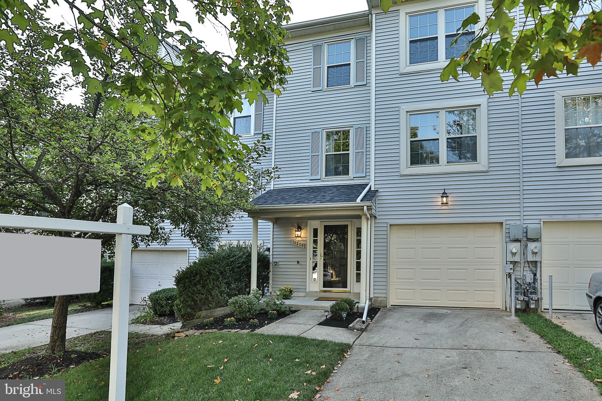 ***Lovely, completely updated garage townhouse in move-in condition!**Everything upgraded**New Roof, energy efficient windows, + sliding doors, appliances and more***Covered porch entry** Expansive main level living and dining area feature hardwood floors. Open floorplan has lots of windows for natural light**Dream kitchen with island has been updated with new tile floor, custom granite, brand new stylish slate appliances, modern pendant lights and ceiling fan - Also large enough for second dining area in kitchen!**Brand new solid sliding glass doors open to deck and treed open space**Upstairs - spacious master bedroom with cathedral ceilings. Adjoining private luxury master bath w/ soaking tub, dual vanities and separate shower** other second and third bedrooms are larger than most - all have ceiling fans**updated hall bath with new tile and light fixture**Whole house has been freshly painted + brand new carpet** Enjoy entertaining in second lower level family room with cozy fireplace** Views and walkout are to treed open space courtyard in backyard**attached 1 car garage means never having to worry about parking! - Additional driveway with space for another car too**Just 1 mile to Howard County General Hospital and near newly developing Columbia Town Center**Easy access to Routes 32, and 175, 95