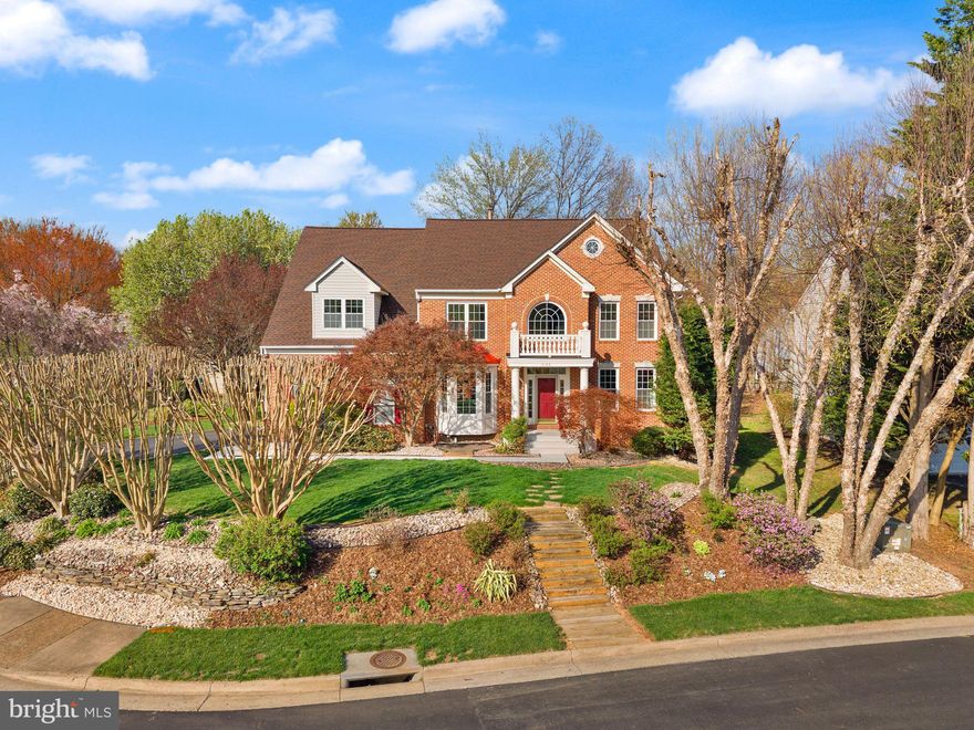 Original owner offering the largest model in the neighborhood, this property delivers a rare combination of scale, meticulous long-term ownership, and extensive capital improvements. Major systems have been addressed, including roof (2017), water heater (2022), and energy-efficient windows (2014). Interior updates are extensive, featuring a fully refinished basement (2018), major 2025–2026 improvements including hardwood flooring installation/refinishing, fresh paint, carpet replacement, and a fully renovated hall bath (2025). The kitchen has been upgraded over time with granite countertops, ceramic tile flooring, and stainless appliances, with continued enhancements through 2025. ** The home’s layout and livability are further elevated by the a spacious family room with gas fireplace, mail level office, and an expansive primary suite complete with sitting area, dedicated second office space, and en-suite bath—offering flexibility rarely found in competing homes. The walk up basement expands the functional living space with a large recreation and billiards room (complete with table, light and cue racks),  dedicated gym, not-to-code bedroom, and a former art studio with a work sink that presents an excellent opportunity for future wet bar conversion. ** The outdoor living experience sets this property apart. Centered around a private in-ground gunite pool (installed 2007) holding approximately 20,000 gallons of fresh water with depths ranging from 3 to 8 feet. The pool has been fully upgraded and refinished (2019) and enhanced with a SunDeck stamped concrete surround (installed 2020, refinished and recaulked 2025). Additional recent pool investments include a new heater (2024), filter system (2025), and Dolphin automatic pool vacuum (2025), creating a turnkey outdoor retreat. ** Additional exterior improvements include front portico renovation (2025), landscape lighting (2024), sprinkler system (2005), and upgraded invisible dog fence (2024). **  Built in 1996 and continuously improved, this home reflects nearly three decades of thoughtful upgrades. This is a rare opportunity to own a highly updated, original-owner home with one of the largest floor plans in the community, combining space, quality, and a fully developed outdoor living experience.