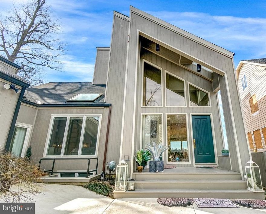 New On Market!  Outstanding  South River waterfront in popular Cape St. John community with private pier, 2 - boat lifts (1-10,000 lb power boat and 1-15,000 lb sailboat),  newly constructed sun deck at pier level, secure storage. This is a contemporary home with soaring ceilings and walls of glass to take in the stunning views. Master Bedroom Suite on 2nd Level has huge water views, gas fireplace, luxury bath with walk-in shower and sunken tub,  private sitting room with wet bar, large walk-in closet and staircase up to loft area above with bonus room and full bath. There is a Main Level guest bedroom off Foyer with fun sleeping loft and is serviced by Full Bath off hall way. A 3rd Bedroom/Suite area is accessible off Kitchen wing which has additional private entrance/exit off Mud Room and features a small kitchenette w wet bar, full bath w laundry facilities.  Full Basement with 4th Full Bath w shower stall and storage. Gorgeous in-ground pool overlooking the river with views of bridge and Mike's Crab House features jacuzzi and resistance swimming feature, winter pool cover on now and has new retractable summer cover. Large 33 x 64 deck for great for entertaining with built-in outdoor gas grill. Nicely landscaped. This is truly a one of a kind property! Conveniently located off Riva Rd corridor with excellent access to Rt. 50, Parole Centre and only 10 minutes to downtown.