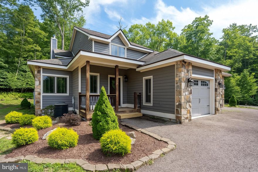 Discover the perfect blend of comfort and style in this finely appointed 3BR, 2.5BA vacation home, offering two fully finished levels designed for relaxation and entertaining. The main level features an inviting open floor plan with hardwood floors, a grand stone gas fireplace, and a spacious dining area filled with natural light. The gourmet kitchen is a chef’s delight, complete with custom cabinetry, upgraded countertops, and stainless steel appliances. Step outside from the living room to a large covered porch backing to trees—an ideal spot to enjoy peaceful evenings. The entry level also includes a primary suite with private bath, a 1-car garage, and recessed lighting throughout.
Upstairs, you’ll find a second expansive primary suite with a walk-in closet and spa-inspired bath featuring a double vanity, tiled tub/shower accents, and ample space for comfort. A third bedroom with bunk beds and its own private bath makes this home ideal for hosting family and friends.
The exterior is equally impressive with fresh re-stained siding, stone accents, and a serene setting tucked just off Lake Shore Drive. Perfectly located minutes from Deep Creek Lake State Park, marinas, restaurants, shops, and Wisp Resort, this home offers year-round fun and convenience.
Beautifully decorated and thoughtfully maintained—this retreat is truly move-in ready!