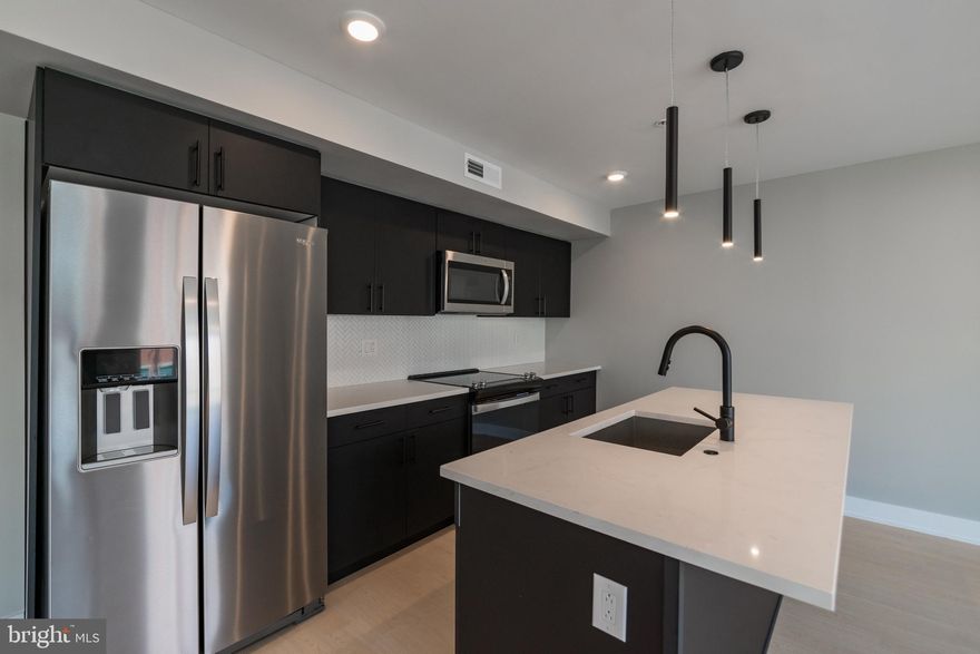 Welcome home to The Azalea, Roxborough’s newest luxury apartment community located along vibrant Ridge Avenue. This brand-new construction combines contemporary style, modern convenience, and a true neighborhood feel — creating a living experience that’s both elegant and effortless.

Perfectly situated just steps from SEPTA bus lines and within walking distance of Manayunk Avenue, The Azalea offers seamless access to regional rail, major roadways, and the best of both Roxborough and Manayunk. Whether you’re commuting downtown or exploring local shops, cafes, and parks, you’ll find everything within easy reach.

Inside, each spacious apartment home is thoughtfully designed with stainless steel appliances, quartz countertops, and matte black finishes that lend a modern, upscale touch. Elegant kitchens and bathrooms feature high-end fixtures, while in-unit washers and dryers make everyday chores simple and convenient. Open-concept layouts maximize every square inch of living space, allowing natural light to fill your home with warmth and comfort.

The Azalea also offers a curated selection of amenities designed to elevate your lifestyle. Residents can unwind on the furnished rooftop deck, enjoy a workout in the 24-hour fitness center, or stay productive in the bright, modern co-working space. Additional conveniences include Latch app-enabled keyless entry, a Parcel Pending package system, and secured garage parking available for $100 per month. For pet owners, there’s even a dedicated outdoor dog run right off the parking lot — because every member of the family deserves comfort.

At The Azalea, you’ll discover a community that’s as stylish as it is welcoming — a place where city energy meets neighborhood charm. Schedule your tour today and see why life truly comes into full bloom at The Azalea.