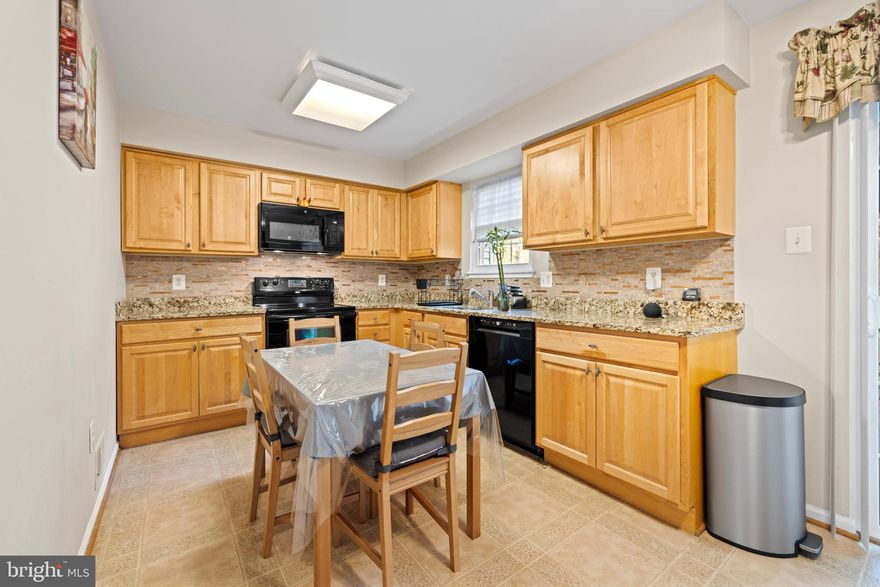 Bright 3 Level finished Townhouse with 2 bedrooms, 2 full bathrooms, and 1 half bathroom. Well maintained home with lots of natural light throughout. Kitchen with black appliances and new backsplash.  Separate living and dining rooms. Fully finished walk out basement with recreation room, cozy fireplace, and laundry area. No pets. Must See! Available Now!