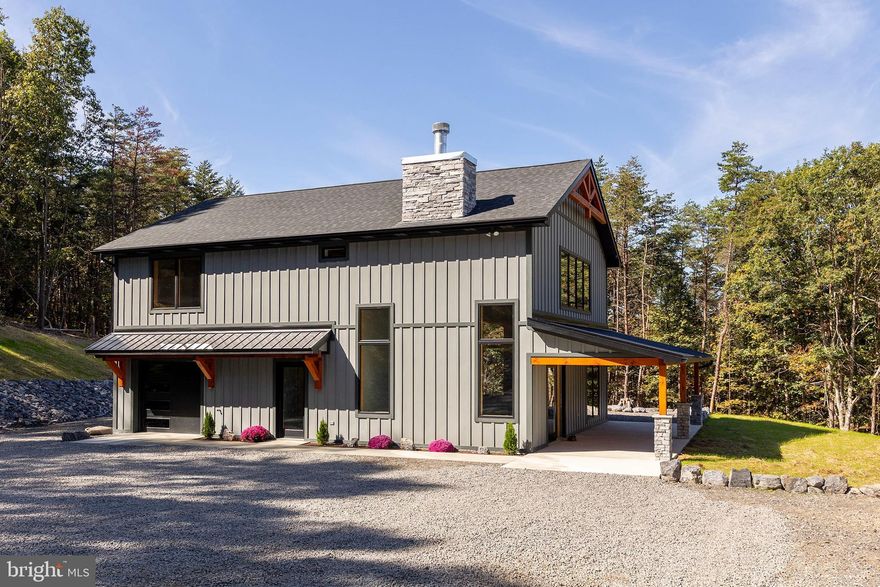 THE PROTOTYPE....THE NEW WAVE OF MODERN MOUNTAIN LIVING IS HERE! A TRUE HYBRID, LOW MAINTENANCE HARDIE PLANK EXTERIOR, CHIC & STYLISH INTERIOR AND WOOD ACCENTS INSIDE AND OUT TO PRESERVE A RUSTIC FEEL. BUILT STRONG TO LAST LONG....INTERIOR FEATURES INCLUDE LVP FLOORING THROUGHOUT, ENHANCED LED LIGHTING, QUARTZ COUNTERS & VANITIES, ANDERSEN WINDOWS & DOORS, HUGE CASEMENT WINDOWS FOR NATURAL LIGHT, MASSIVE WOOD BURING FIREPLACE AND DUCTLESS MINI SPLITS FOR INDIVIDUAL TEMPERATURE CONTROL. OH YEAH, IT HAS INCREDIBLE VIEWS TOO! BUILT BY THE AREA'S PREMIER BUILDER, BRYSON HOMES, THIS PROTOTYPE WAS BUILT WITH RELAXATION AND RECREATION IN MIND....PRIVATELY LOCATED ON 20 ACRES OF 100% USABLE LAND WITH AN ATV TRAIL AROUND THE PERIMETER, PRIVATE SHOOTING RANGE, AMPLE PARKING & STONE ACCENTED AREA AROUND THE HOME. THE LOCATION....JUST INSIDE THE COMMUNITY GATE, ONLY 1.5 MILES OFF THE PAVED ROAD AND LESS THAN 10 MINUTES FROM THE ADORABLE & THRIVING VILLAGE OF FORT ASHBY IN THE PRESTIGIOUS GATED COMMUNITY OF "THE BLUFFS ON THE POTOMAC".....THE BLUFFS IS KNOWN FOR IT'S ABUNDANCE OF BIG BUCKS, BEAR & TURKEY. AS AN ADDED BONUS, THE COMMUNITY HAS IT'S OWN PRIVATE COMMON AREA ON THE SOUTH BRANCH OF THE POTOMAC RIVER FOR CANOE, KAYAK, TUBES, FISH & SWIM......A PRIVATE PARK ON THE RIVER FOR YOUR SUMMERTIME ENJOYMENT. HUNT, SHOOT, ATV'S, .....THIS LAND IS LOADED WITH GAME.....2 MILES FROM STOCKED TROUT LAKE & 3 MILES FROM THE COMMUNITY RIVER ACCESS....ENDLESS OUTDOOR ACTIVITIES AT YOUR FINGERTIPS. THE PERFECT WEEKEND RETREAT OR FULL TIME HOME IN THE MOUNTAIN STATE....ONLY 2.5 HOURS FROM DC/BALT METRO BUT FEELS LIKE YOU'RE 1000 MILES AWAY FROM THE RAT RACE! BRAND SPANKING NEW AND TOO COOL FOR SCHOOL. THE FUTURE IS NOW! IT'S TIME TO START LIVING YOUR BEST LIFE IN ALMOST HEAVEN!