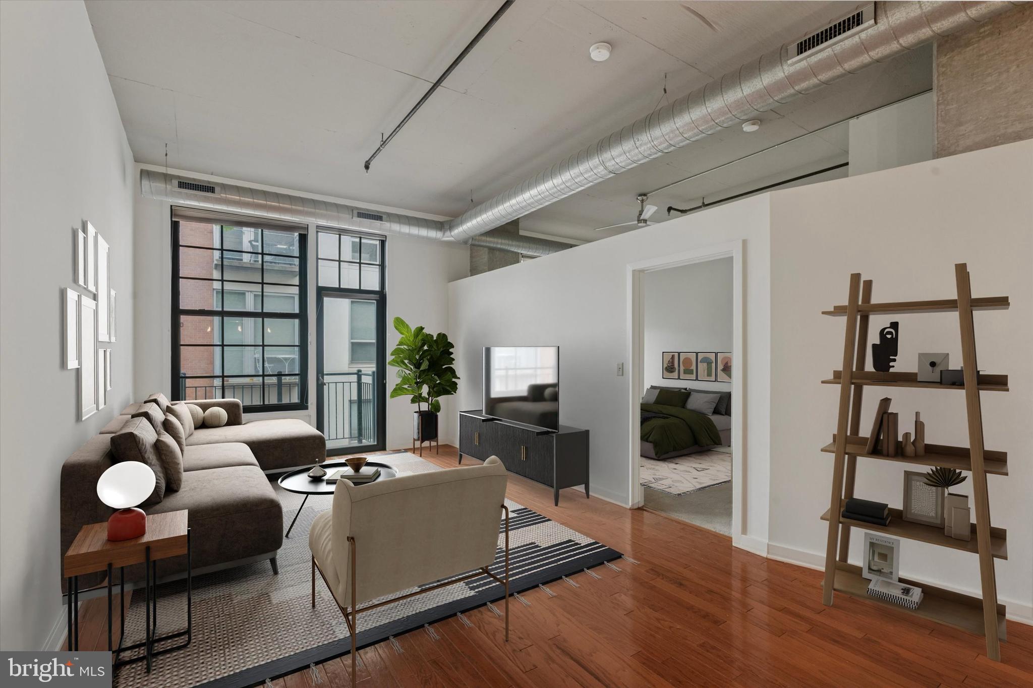 Elevated city living at The National, a distinguished gated community in the heart of historic Old City. This 2-bedroom, 2-bath residence offers sweeping skyline views and thoughtfully designed interiors, including hardwood flooring, ceiling fans, and an open kitchen outfitted with stainless steel appliances, granite countertops, and sleek finishes. The spacious living room is framed by a generous window and a door that leads to your private balcony.
The primary suite features an ensuite bath and an abundance of closet space, while expansive windows invite in a warming glow of natural light. The second large bedroom - also outfitted with an incredible amount of closet and storage space - is on the other end of the unit for ideal privacy. Its dedicated full bathroom is right across the hall. Laundry is easily accessible to both rooms. The washer and dryer sit behind double doors in the hallway.
This particular unit comes with a deeded underground parking spot providing seamless convenience for commuters and city dwellers alike. Elevator access to your unit from the garage means you stay dry and warm going from your car to your home regardless of the elements. Level 1 Fitness is on the first floor of The National. Membership is available for an additional fee.
Set amidst a culturally rich neighborhood known for its art galleries, independent boutiques, and acclaimed dining, this home places you moments from Elfreth's Alley, the Benjamin Franklin Bridge, Race Street Pier, and Cherry Street Pier. The National presents a wonderful opportunity to own within one of Philadelphia’s most dynamic and architecturally significant areas.