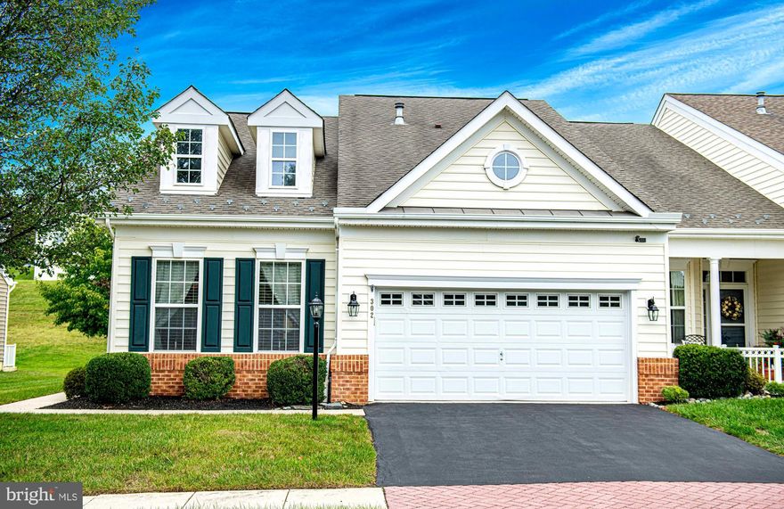 This stunning villa-style end-of-group townhome is located in the gated community of Bulle Rock in Havre de Grace, offering a wealth of amenities such as indoor and outdoor swimming pools, tennis courts, walking and jogging paths, a recreation center, lawn maintenance, snow removal, and so much more. The home features a main floor primary bedroom with a walk-in closet and an ensuite bathroom complete with a soaking tub and walk-in shower, as well as an additional main-level bedroom and full bathroom. The main level showcases gleaming hardwood floors, a kitchen with granite countertops, a built-in breakfast bar, 42-inch cabinets, and stainless steel appliances. The open dining and living room area flows into a sunroom, which opens onto a beautifully hardscaped paver patio. The main level also includes a convenient laundry room. Upstairs, a flexible loft space accompanies a third bedroom and a full bathroom, along with an extra storage closet. The large basement offers plenty of potential for additional living space, with a full rough-in for a bathroom and walk-up access to the backyard. Completing the home is a two-car garage.
Come see this beautifully maintained home today if you are looking for an active, low maintenance lifestyle in this sought after community; close to downtown Havre de Grace, APG, restaurants, and just off of I-95 for an easy commute.