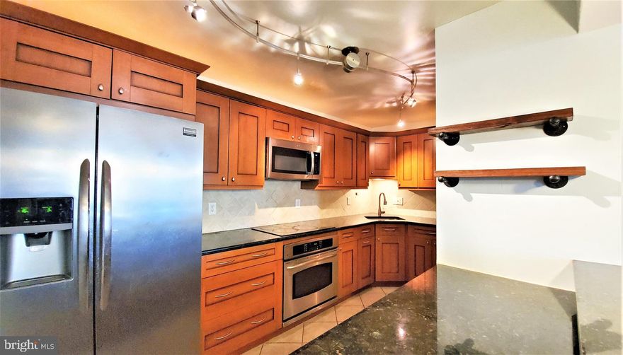 Welcome home to SAINT PAUL AT CHASE UNIT 412...Downtown Pied a Terre, Upper Eastside  meets Baltimore. Contemporary renovated 2BR 2BA  located in one of Mt. Vernon's most popular condo buildings.   Generous floor plan ideal for entertaining as well as everyday living. Grand kitchen complete with custom cabinets, granite counters, stainless appliance and breakfast bar.  Owners suite is a retreat with walk-in closet, en-suite bathroom, spa soak tub and heated floors.   Washer/Dryer in the unit. Located on the 4th Floor with professional offices for lawyers and doctors, this unit has the option to be utilized as a live / work space.  The Northeast corridor awaits you at your front door... Penn Station is only blocks away providing access to MARC and AMTRACK trains with service to  Washington, D.C., Philadelphia, NYC and more... local travel is in close proximity with shuttle routes for JOHNS HOPKINS UNIVERSITY, UNIVERSITY OF MARYLAND, CIRCULATOR and LIGHTRAIL. Steps to THE IVY HOTEL for tea, THE PRIME RIB for dinner and drinks, MEYERHOFF SYMPHONY HALL home of the BSO, THE LYRIC, STATION NORTH, THE CHARLES and PARKWAY MOVIE THEATERS, WALTERS ART MUSEUM, PEABODY CONSERVATORY, MOUNT VERNON SQUARE, UNIVERSITY OF BALTIMORE, MICA, shops, restaurants and nightlife. Major thoroughfares, commuter routes and direct entry to 83 make for effortless driving.  SAINT PAUL AT CHASE is a full service secure elevator building with 24-hour front desk and valet parking.   Attached underground garage parking available for additional $150/mo. This is City Living at it's Best!