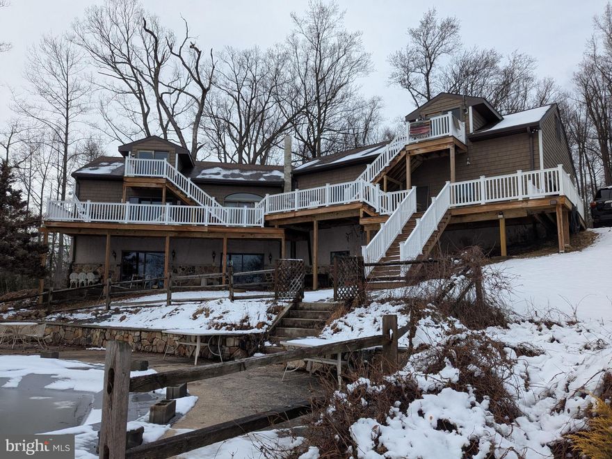 This waterfront property offers incredible potential and a rare opportunity to create something truly special. The home experienced storm damage several years ago, and while significant improvements have already been completed, the property is still in the process of being renovated and will require additional work to finish.
Recent updates include all new windows, new siding, a new roof, a new dishwasher, and a newly built deck. The basement has been completely gutted and is ready to be finished.
The home offers a spacious layout with unique features, including a primary bedroom with a loft and sliding glass doors that open to the deck, providing beautiful natural light and a relaxing connection to the outdoors.
Another standout feature is the separate above-garage apartment/in-law suite, which includes a bedroom, bathroom, mini-kitchen, and private entrance, offering great potential for guests, extended family, or additional living space.
The property also includes both an attached garage and a large detached garage, providing plenty of storage, parking, and workspace.
Situated on 3.12 private acres along the water, the setting is truly the highlight—offering peaceful views, privacy, and plenty of space to make this property your own.
The seller is unable to complete the remaining renovations, and the property is being sold in its current condition. With vision and finishing touches, this home could be transformed into an exceptional waterfront retreat.