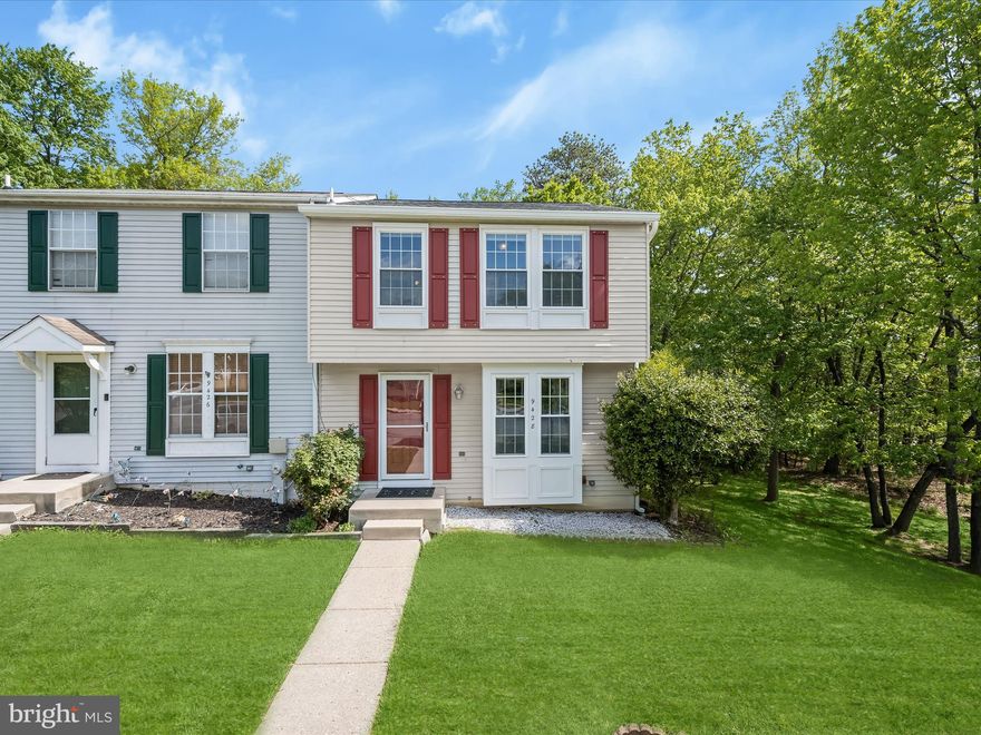 Nestled in a peaceful setting, this inviting end-unit townhome offers exceptional privacy and comfort, backing to a large common area with mature trees. The spacious living room features gleaming hardwood floors, three bright windows, and a convenient pass-through to the kitchen. The eat-in kitchen boasts granite countertops, stainless steel appliances, electric cooking, a built-in microwave, ceiling fan, and ample table space illuminated by pendant lighting. Sliding doors open to a generous deck—perfect for outdoor dining and relaxing. Upstairs, the primary bedroom includes three sun-filled windows, a vaulted ceiling with a fan, a custom closet with built-in shelving, and an en suite bathroom with a soaking tub. The second bedroom offers two bright windows, another custom closet, and its own en suite bath with soaking tub. The finished lower level showcases a cozy family room with luxury vinyl plank flooring, a wood-burning fireplace with a stately wood mantel, a ceiling fan, and sliders leading to a paver patio and fully fenced rear yard. This level also includes a laundry room, a powder room, and additional storage space. Enjoy outdoor living with a fully fenced rear yard, private paver patio, and serene views of trees and open space. A secure storage shed is also included.