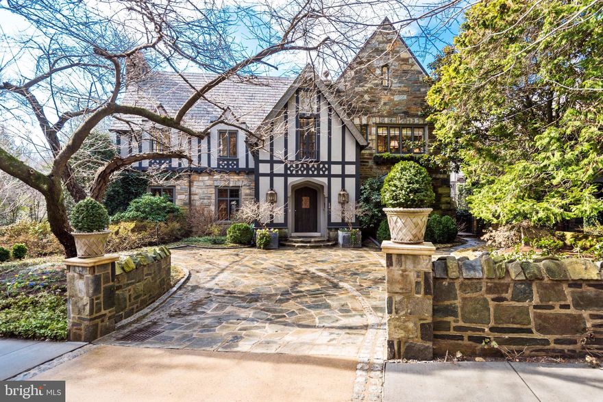 Stately stone and stucco facade reveals an open and airy interior of over 7,000 SF.  Main level features elegant foyer, formal living and dining rooms, study, and sun-drenched, south-facing kitchen/family room with 10' ceilings overlooking private back garden with pool, and woodland backdrop of Normanstone Park. Upstairs are an expansive owner suite with sitting room, office, and two en suite bath/dressing rooms, plus four additional generous bedrooms each with great closet space and en suite bath. Finished lower level features large family room with fireplace, nanny/in-law suite, pool changing room, and wine room. Private and sought-after location close to Cathedral Schools, Maret, WIS, and offering quick commutes downtown and throughout Washington via Rock Creek Park and Massachusetts Avenue.