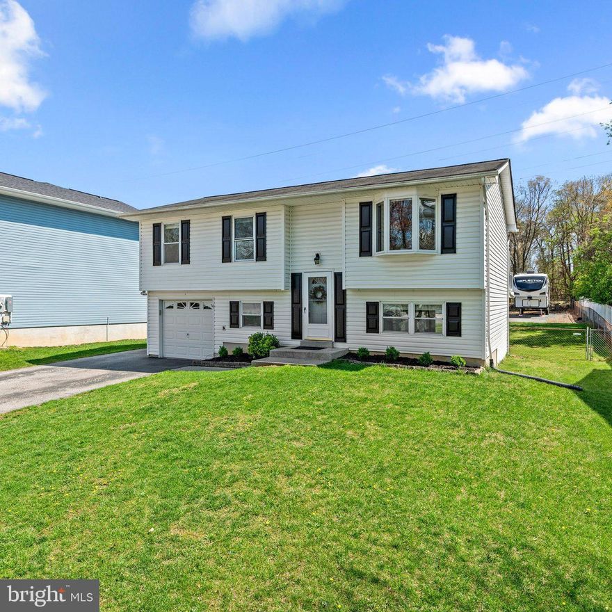 Welcome to 1505 Wampanoag Drive — a beautifully refreshed, move-in ready split-foyer home in Wethersfield, a quaint tree-lined community in Severn.   From the moment you arrive, you'll appreciate the charm of the neighborhood, complete with sidewalks, mature trees, and pride of ownership throughout.   Best of all, no HOA fees.

Step inside to discover a freshly painted interior with brand-new carpet and luxury vinyl plank flooring, creating a clean and inviting atmosphere.  The spacious layout includes 4 bedrooms and 2 full baths, offering flexibility for families, guests, or home office needs.

The finished walkout lower level opens to a flat, fully fenced backyard — a perfect space for play, pets, or outdoor entertaining.   Overlooking it all is a maintenance-free deck with an awning, ideal for relaxing in the shade or dining al fresco.   One of the standout features is the oversized detached garage, complete with 60-amp electric service and plumbing — perfect for car enthusiasts, hobbyists, or workshop space.

Located just minutes from Fort Meade, NASA, BWI Airport, and the MARC Train, this commuter-friendly location offers unmatched convenience. Whether you're heading to D.C., Baltimore, or Annapolis, your ideal launch point is right here!

This home is perfect for anyone looking for a turn-key lifestyle in a well-maintained and welcoming community.   Come see it today and fall in love!  ***BONUS:  Assumable VA loan rate of 2.75% for qualified Buyers****