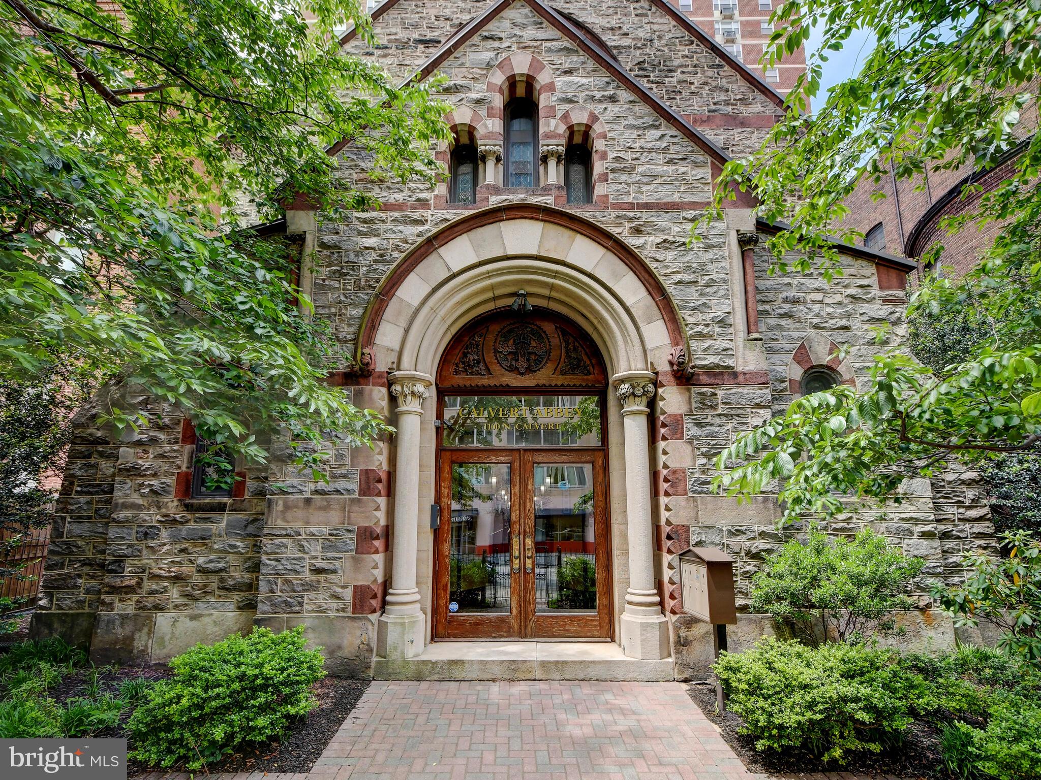 This truly unique home will satisfy the most discerning buyer looking for character, charm and 21st century conveniences in an historic Mount Vernon church-turned-condo. With only four units in this building converted in 2007, unit #2 is the prime opportunity to own a three story home where original stained glass windows on three sides cast gems of light throughout the home. As you enter on the first floor you will find the guest bedroom and full bath plus ample storage space and access to a small outdoor brick terrace perfect for your BBQ grill. Going up a flight brings you to a dramatic open living room/dining room and kitchen with Corian counters, stainless appliances and Kohler fixtures plus a convenient powder room. You will enjoy stained glass windows in the living room as well as a huge arched stained glass window on the staircase to the upper lofted level. At the top of the stairs you will appreciate the flex space with scenic clerestory overlook that can be used as a den/reading room, home gym or home office. The primary bedroom enjoys a sweet view of the arched window that casts jewel-toned light and features a full bathroom with tiled shower and walk-in closet. The high ceilings, open spaces, large windows and original details all make for an inspiring environment to enjoy your downtown lifestyle! You are walking distance to the Mayerhoff Symphony Hall, the train station, the Sunday Farmer's Market and many prime Mount Vernon restaurants and only minutes to UB. JHU, MICA, UMD and the Inner Harbor!