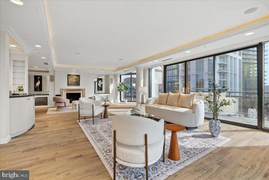 Absolutely stunning two-level penthouse residence offering sweeping panoramic views of Arlington through dramatic floor-to-ceiling window walls. This rare 3-bedroom, 4.5-bath home is a true showpiece, combining architectural scale, refined finishes, and extraordinary natural light throughout.

Designed for both grand entertaining and comfortable everyday living, the expansive main level features open sightlines, recessed lighting, and multiple seating areas framed by breathtaking skyline views. A formal dining room provides an elegant setting for hosting, while a dedicated built-in office area with custom millwork and integrated storage creates a polished and highly functional workspace.

The chef’s kitchen is beautifully appointed with extensive cabinetry, generous prep space, sleek appliances, and quality countertops, offering both style and practicality.

All three bedrooms are generously sized and privately situated, each with its own ensuite bath. The primary suite is truly exceptional, featuring a private hallway entry, an expansive walk-in closet with custom shelving, and the rare luxury of two separate full baths—creating a uniquely private and refined retreat.

With its dramatic window walls, seamless flow between living spaces, and commanding views from nearly every room, this home is ideal for entertaining.

This exceptional rental includes four dedicated parking spaces and two storage units, an uncommon and valuable offering in this prime Rosslyn location.

Ideally positioned in the heart of Rosslyn, residents enjoy convenient access to Georgetown, Clarendon, and the vibrant Rosslyn corridor. Nearby favorites include Sfoglina, Salt, Ambar, CIRCA, Whole Foods, and Safeway, along with close proximity to the Rosslyn Metro (Blue, Orange, and Silver lines), Theodore Roosevelt Island, the Georgetown waterfront, the Kennedy Center, and Reagan National Airport just 4–5 miles away.