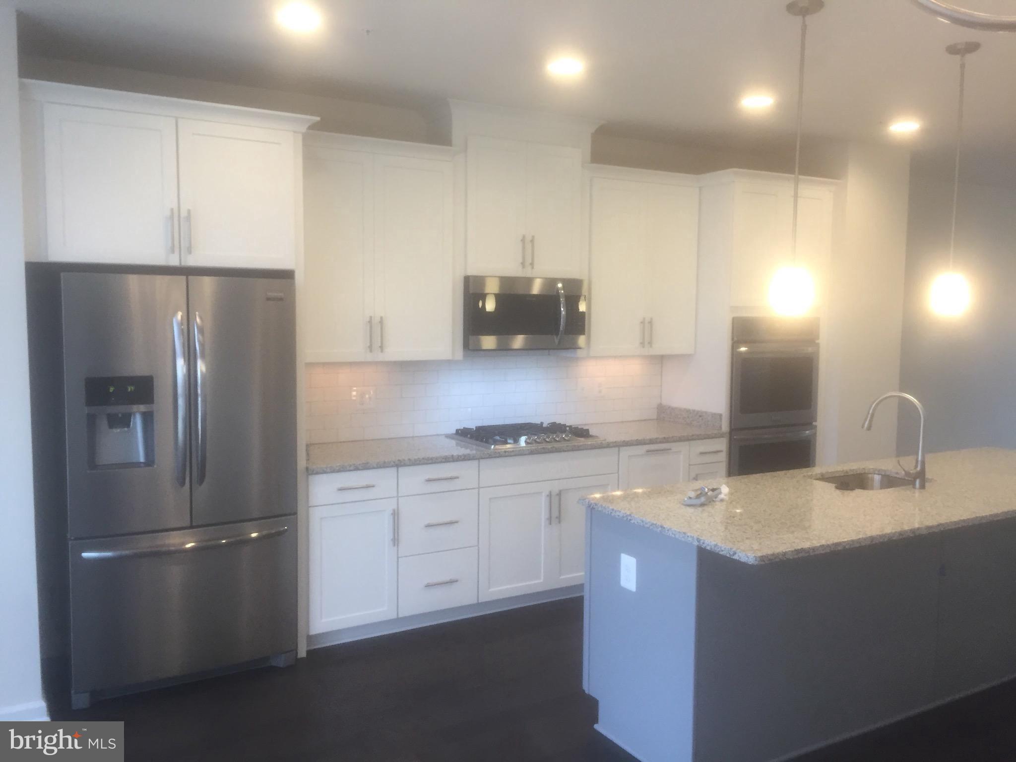 Make this modern well crafted home yours today! This large fantastic townhome is steps away from the metro station, shopping and more ! This home features luxury flooring, stainless steel appliances, modern countertops, a large living and dining room space, large bedrooms, huge walk-in closets, and a modern in-unit washer and dryer and a two car garage. Tour today.