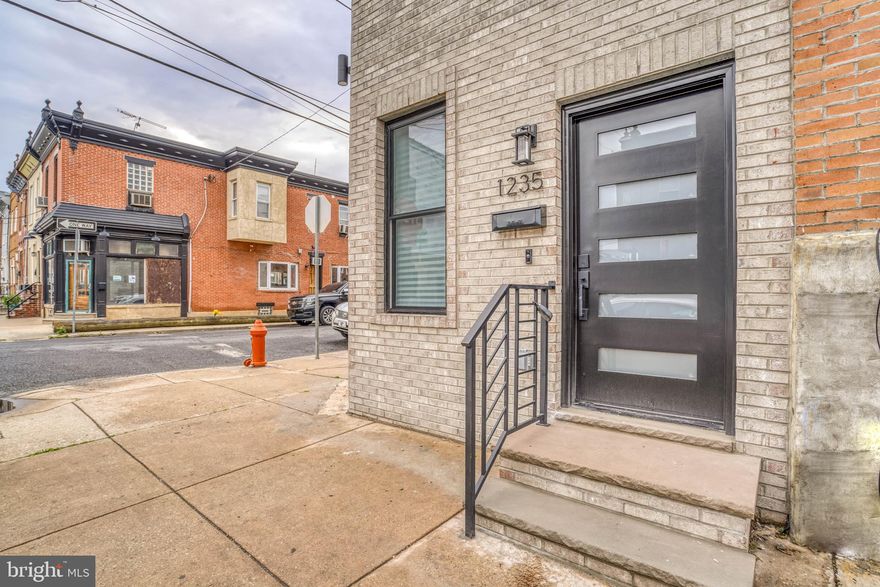 Beautiful new construction in prime Grays Ferry area ,with tons of development all around  !!
 Corner three story featuring 4 bedrooms ( 2 primary ) and 4 bathrooms ( 2 primary ) ! 
  Living room /dining  area combo with wide plank hardwood floors , recessed lights  leading you to a gourmet island kitchen with stool seating .  The kitchen features 42 inch cabinets with accent lighting top and bottom , large island with built in microwave , pendant lighting lights , stool seating with accent lighting , cascade quartz counter , full solid quartz back splash , stainless steel sink ,refrigerator, dishwasher , range vent , garbage disposal , pot filler , recessed lights .  Sliders out to a rear cement yard with wooden privacy fence and gate .  Open entry to the finished  basement recreation room  with ceramic tiled flooring , laundry closet , HVAC closet and recessed lights for additional living space .
Beautiful floating steps from the living room with motion sensor led accent lighting guiding you to the second floor which offers front bedroom 1 with hardwood flooring and double closet and recessed lights . Hall linen closet .  A stunning hall bath with ceramic tiled floors and walls, stall shower with seat bench, glass door, led lighted mirror, sink cabinet and toilet   . Primary bedroom 2 with primary full bathroom, tiled walls and floors , tub shower combo, led mirror , hardwood floors , recessed lights  and double closet . 3rd floor offers front bedroom 3 with hardwoods , recessed lights , double closet . Hall linen closet . Another beautiful hall bath with unique black smoke tiled walls and flooring , tub/shower combo , led light mirror , sink cabinet . Primary bedroom 4 with primary bath with stall shower , seat bench , lighted led mirror , sink base cabinet . Accent lighted steps take you to the large  roof deck level with the million dollar views of the city skyline !!! Perfect and impressive for entertaining or just your relaxing chill space  !! 
Every attention to detail , lots  accent lighting, every closet has a light , upgraded door knobs , faucets , quality tile work through out , led lighted mirrors and much more !!! this is must see in person !!
Almost 2000 sq ft of finished living space and a roof deck , 2 primary bedrooms , perfect for room mate situations , investment rental ? Air Bnb ?  or the perfect large  family home !!! 
professional photos coming soon !!! 
Dont miss out on this price point