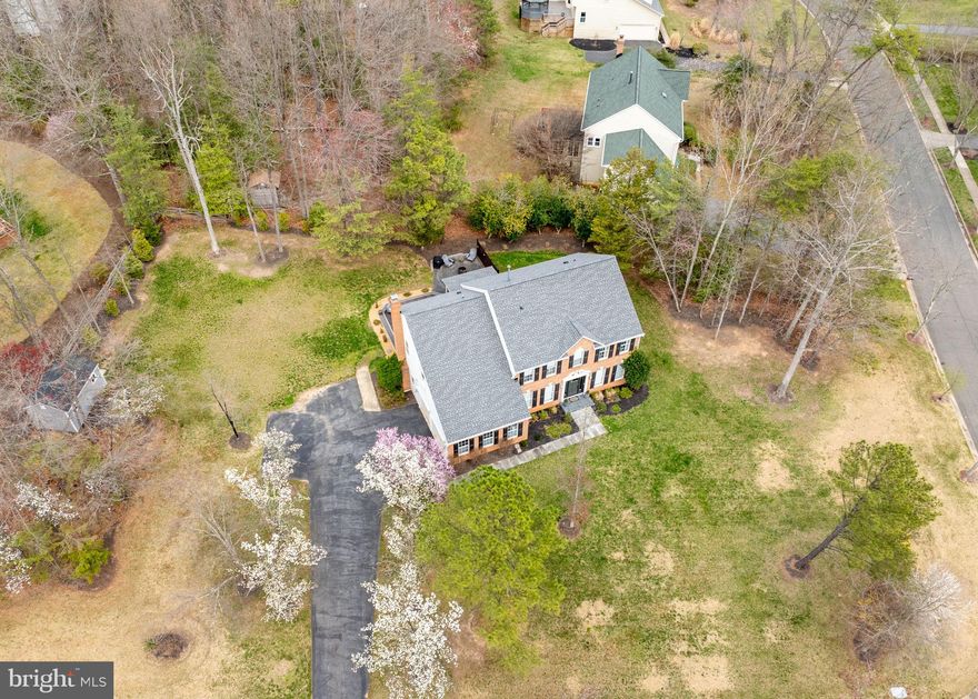 Open House canceled. Welcome to a meticulously renovated residence offering unparalleled luxury and modern comfort. This exceptional home underwent significant upgrades resulting in a showcase of high-end finishes and thoughtful design.  
Gourmet Kitchen & Open Living:
Prepare to be wowed by the chef's kitchen, featuring expansive quartz countertops, a center island with eat-in seating, and a convenient bar counter with a second dishwasher – perfect for entertaining! High-end cabinetry and top-of-the-line appliances make this space a culinary dream. The expansive great room boasts soaring ceilings and flows seamlessly into the kitchen, creating an inviting atmosphere for gatherings. The dining room, open to the living room, creates a flexible space ideal for large family gatherings and entertaining.
Luxurious Indoor-Outdoor Living:
Bifold walkout doors open to a spacious deck and an expanded patio area, ideal for grilling and enjoying evenings around the fire pit. This seamless indoor-outdoor connection extends your living space and enhances your lifestyle.
Elegant Details & Modern Upgrades:
Throughout the home, you'll find high trim and crown moldings, adding a touch of sophistication. The primary bathroom is a true retreat, featuring a large, double-person shower and a separate soaking tub. All bathrooms have been beautifully renovated with modern fixtures and finishes. A large, built-out laundry room space above the garage offers exceptional convenience and doubles as an extra bedroom, providing versatile living options. The finished basement includes an additional room and a full bathroom, perfect for guests or extended family.
Key Updates & Efficiency:
Renovations: Fully renovated 2018-2020.
Kitchen: High-end kitchen with quartz countertops, center island, bar counter, and dual dishwashers.
Bathrooms: All bathrooms fully renovated.
HVAC: New AC and heat pump on the main floor.
Water Heater: Efficient tankless gas water heater.
Roof: New roof installed in 2021.
This home offers the perfect blend of elegance, comfort, and modern convenience. Don’t miss your opportunity to own this exceptional property in Glenn Dale! Schedule your showing today!