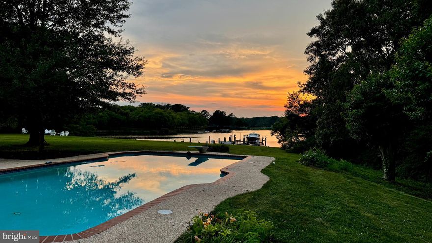 Miles Away on Murphy’s Point – Discover an unparalleled waterfront retreat at 28092 Glebe Rd, Easton, MD, nestled on approximately ±2.7 picturesque acres. Thoughtfully designed for entertaining, relaxation, and convenient living, this luxurious estate offers expansive indoor and outdoor spaces, exceptional waterfront amenities, and easy access to nearby towns, beaches, and metropolitan areas.

With impressive construction and thoughtful expansion, this property promises both comfort and elegance. The estate blends serene rural charm with unmatched convenience, situated just minutes from the vibrant heart of historic Easton. Known for its rich cultural scene, charming boutiques, award-winning restaurants, and year-round events, Easton offers residents a sophisticated yet laid-back lifestyle on Maryland's coveted Eastern Shore.

This expansive estate features generous open spaces perfect for gatherings, multiple luxurious bedroom suites, a dedicated theatre room, versatile office spaces, and two substantial garages flanking the home—accommodating up to eight vehicles. Outside, the property unfolds into a private paradise with meticulously landscaped grounds, inviting outdoor living spaces surrounding the waterfront pool, a complete pool house, and a waterside firepit ideal for enjoying stunning sunset views.

Exceptional elevation provides sweeping northwest views over Glebe Creek, complete with a private pier and boat lift, offering easy navigation to the Miles River and the iconic waterfront town of St. Michaels. Whether you're exploring the charming streets of Oxford or dining along historic waterfront, this location places you within a short, scenic drive or boat ride of  the Eastern Shore's  finest towns and attractions.

Built in 1995 by Bay Country Builders, this impressive home was thoughtfully expanded in 2001 by renowned Lundberg Builders, resulting in approximately ±7,366 square feet of luxurious yet comfortable living space. With 7 bedrooms, 8 full baths, and 2 half baths, the layout is ideal for hosting guests and multi-generational living, while remaining easy to maintain.
Strategically located, this estate is just a short drive from Route 50, connecting residents to nearby beaches such as Ocean City and Rehoboth Beach, as well as major metropolitan areas including Annapolis, Baltimore, and Washington D.C. Additionally, convenient access to Easton Airport (ESN) makes travel effortless. Come home to Miles Away on Murphy’s Point—a rare opportunity to embrace Eastern Shore living at its finest.