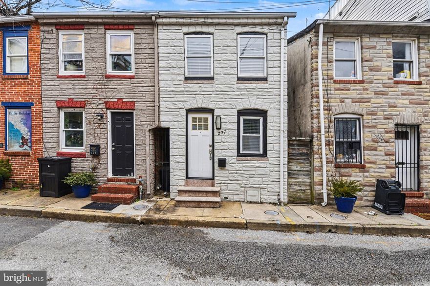 Check out this Baltimore charmer! Located on the very street where legendary jazz singer Billie Holiday grew up, this classic rowhome is filled with character and rich local history. The block features vibrant murals honoring the famed singer, adding unique cultural appeal right outside your door. Inside, you’ll find hardwood floors throughout and a warm, inviting living space highlighted by exposed brick in the living room and along the staircase, a true nod to Baltimore’s timeless architecture. The kitchen features granite countertops, crisp white cabinetry, and convenient main level laundry. Upstairs offers two comfortable bedrooms and one full bath. The bathroom is beautifully finished with a luxury tiled shower, adding a modern touch to this historic home. Step outside to your private patio and fenced backyard, perfect for summer barbecues, entertaining, or simply enjoying your morning coffee. Ideally situated near Patterson Park and just minutes from Fells Point’s waterfront, restaurants, and nightlife, this home offers the perfect blend of historic charm and vibrant city living.