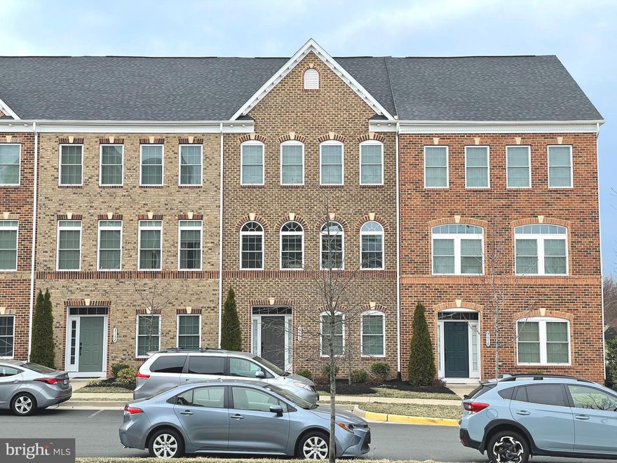 Open House Saturday 3/26 1-4PM.  Luxurious 4 bedroom 3.5 bathroom, 4 level brick front townhouse with rear 2 car garage, rooftop terrace and deck. This is the popular John Jacob Astor model built by NV Homes. Open floorplan, with rear kitchen to provide more cabinet spaces, and a larger center island with dual bowl sink, goose neck faucet and dishwasher. SS GE appliances, range hood that vents out,  shaker style white kitchen cabinets with dark gray granite countertops. HW floors on the lower level hallway and main level, oak stairs with white risers on two levels. Two HVAC units and tankless water heater. Exterior features low maintenance brick front, rear has Hardi-plank siding, composite deck. Front of the house has a clear sight to the community common area, and the playground is steps away behind the home. There are plenty of guest parking spaces and this home is at the quieter end of the community with less cars driving by. Windows have blinds and roller shades installed. The lower level storage room has plumbing ready for a full bathroom build-out. Fourth level loft features a bedroom, full bathroom, storage, closet, and roof-top balcony. The primary bathroom has the upgraded shower. The laundry room is on the bedroom level. The primary bedroom and the 4th floor bedroom features a walk in closet. Ceiling fans are installed in all the rooms and the office. The home is in excellent condition, with many energy efficient features. Discovery Square is minutes away from Route 28, 267, shops, Dulles airport and many parks.