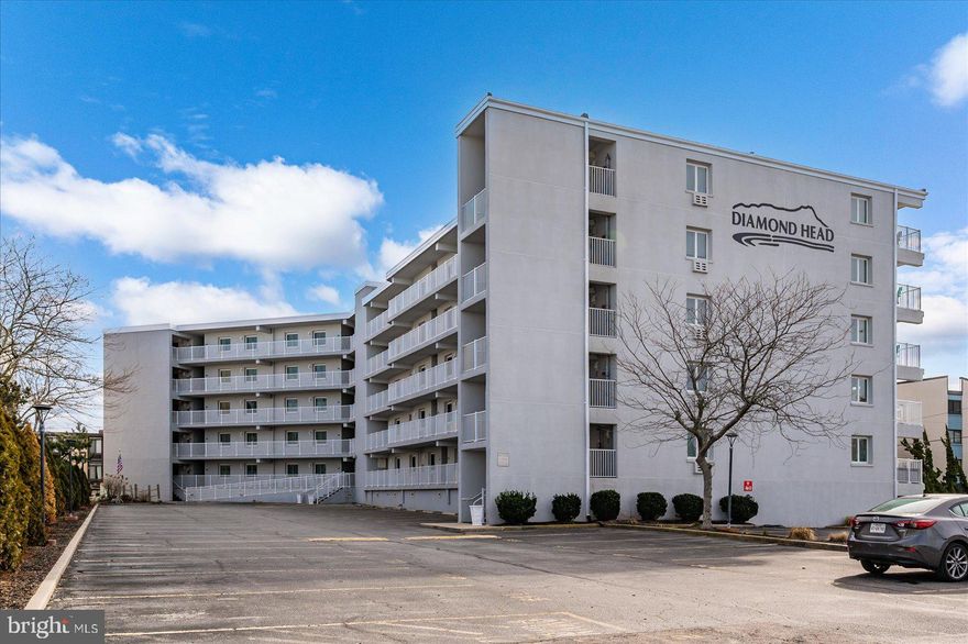 This  one-bedroom, one-and-a-half-bath condominium offers the perfect blend of comfort, convenience, and coastal living!  Situated just steps from the beach, you’ll enjoy easy access to the ocean along with beautiful sunset views that can be admired right from your private balcony. The property is also just a short and enjoyable bike ride to the iconic Ocean City boardwalk! The Diamond Head building has recently completed a series of significant improvements designed to enhance both appearance and durability, including new windows and sliding glass doors, updated vinyl railings, recoated walkways and decks, and a freshly painted exterior. Building amenities include an oceanfront outdoor swimming pool, elevator access, and one assigned parking space. This condo places you just moments from the beach and within close proximity to a wide variety of restaurants, shopping and entertainment options for all ages. Start enjoying everything this coastal property has to offer!