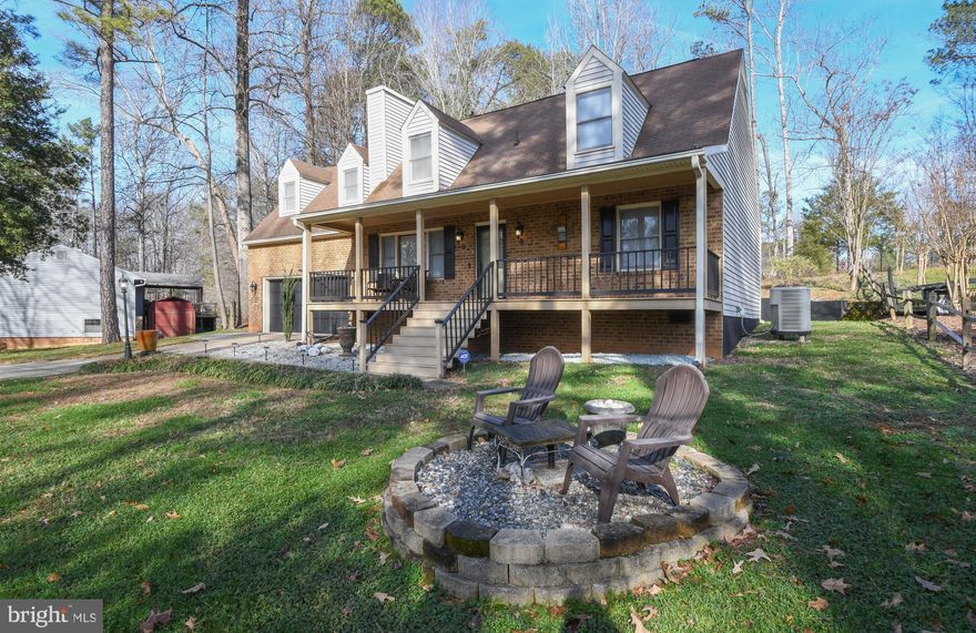 BACK ON THE MARKET!!! Buyers financing fell through. Grab a cup of coffee and a good book and sit down on your new front porch that looks out over the lake. This lovely Cape Cod with two car garage has a spacious and open floor plan including an added all season room that sits just off of the kitchen for additional living space. Two bedrooms and a full bath on the main floor and another two  bedrooms, a bonus room and full bath reside on the upper level. The home has been meticulously and lovingly tended and has numerous upgrades including the kitchen, bathrooms and flooring. Walk across the road to a charming fishing pier and picnic area. The Lake Caroline offers many outdoor activities including  several parks, 2 beach areas, tennis and basketball courts, a pool and a kiddy pool with lifeguards on duty. The neighborhood is great for walking, biking, along with many activities at the lodge through the year. Don't miss this one!