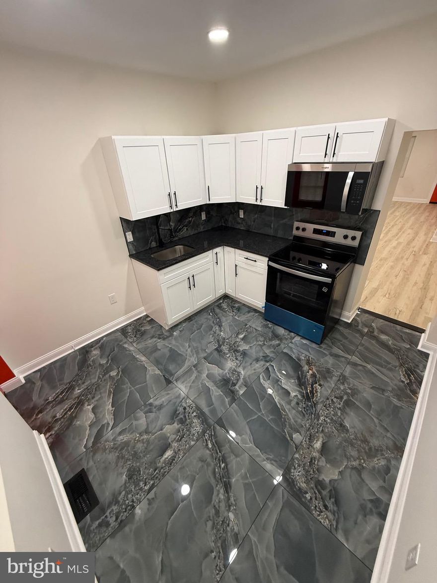 Fully renovated 4-bedroom, 2-bath home located on a quiet block in the Tacony section of Philadelphia. This move-in ready property features luxury vinyl flooring throughout, a modern kitchen with granite countertops, stainless steel appliances, and updated bathrooms with floor-to-ceiling tile.

The fully finished basement offers a huge additional living space with a private bedroom and full bathroom, providing flexibility for extended living or guest use. Central air and updated mechanical systems add comfort and peace of mind.

Enjoy a private fenced backyard, perfect for outdoor relaxation or entertaining.Conveniently located near I-95, public transportation, shopping, and dining.

Seller is motivated and open to reasonable offers. Easy to show—schedule your appointment today.