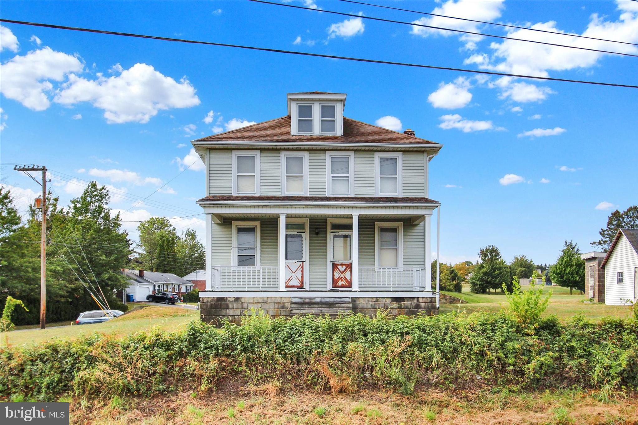 Welcome to 2040 Windsor Road, a classic farmhouse originally built in 1926. This charming property has been updated with siding and a roof, and sits on a level 1.15-acre lot complete with numerous outbuildings. Inside, the home offers a spacious kitchen, two full baths (one on each floor), and a walk-up attic. The fourth bedroom is a walkthrough, making it a flexible space for an office or nursery. While the home does need some cosmetic updates, it provides the perfect opportunity to add value and make it your own. The barn was used as a working car shop on the first floor and generous storage space on the second, while additional outbuildings—including a small silo/storage unit—add character and functionality to the property. Offered for cash or conventional financing only, this home is an excellent opportunity to bring your paintbrush, build equity, and create your ideal homestead.