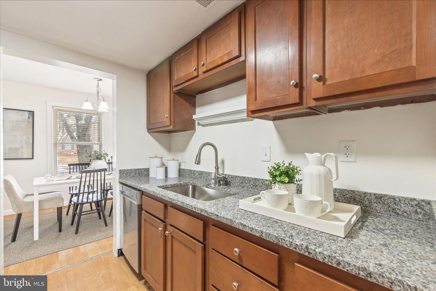 Why rent when you can OWN ...Come see this  Beautiful Colonial Townhome showcasing 3 Levels, with 3 bedrooms, and 1.5 bathrooms. This interior unit showcases contemporary finishes and a thoughtful layout that maximizes both style and functionality. The main level custom kitchen with functional countertops, and stainless-steel appliances will enhance your cooking experience. Complete with a main level open floor plan and walkout basement. The bathrooms have been tastefully refreshed adding elegance to this classic Colonial style townhome,  Close to  restaurants and shopping,. Move in ready, cleaned and freshly painted, Schedule to see this amazing home today.