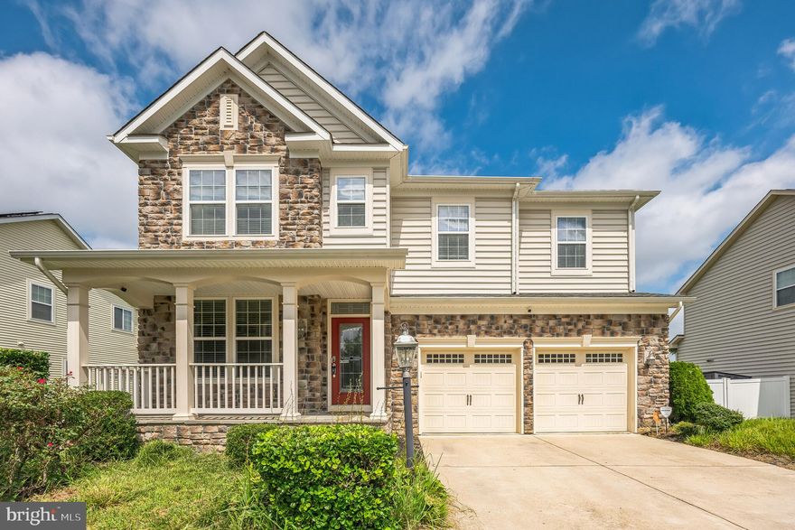 This gorgeous home was the builder's model home!  Welcome home to this stunning stone front colonial nestled in the sought-after Gleneagles Community that backs to open space and pond. Enjoy summer days on the covered front porch or retreat on the spacious back deck.  As you enter this beautiful home, you will be greeted by the gleaming hardwood floors and the stunning office with built-ins.  The gourmet kitchen features stainless steel appliances, granite countertops, dual oven, hardwood floors and open to the family room with a stone gas fireplace.  Upstairs you'll find a large loft, master suite with tray ceiling, three additional sizeable bedrooms, guest bath and laundry room. The basement offers a recreation room with full bath and additional space for your imagination.  Other features includes surround sound throughout the house, never worry about your grass again with the in-ground irrigation system, and  workout on the included gym equipment. Absolutely beautiful home in this desirable, mature neighborhood.