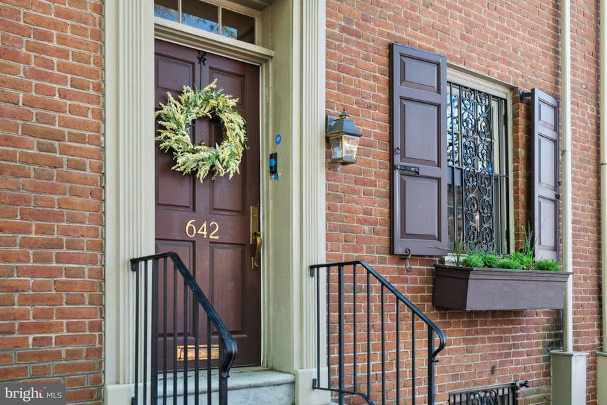 Welcome to 642 Pine St! This stunning property blends historic charm with modern updates, creating a truly unique and elegant home in Society Hill. The large footprint boasts 4 spacious bedrooms, 2.5 baths, a den, a finished basement and a private garden, all just a few blocks away from paid monthly parking.*

As you step inside, you'll immediately be struck by the fully updated kitchen complete with top-of-the-line Wolf appliances, classic subway tile backsplash, quartz countertops and granite floor tile making a pristine yet warm space to cook for family & friends. The open living and dining room space are inviting to relax in front of the fireplace or bathe in the natural light pouring through the French glass doors. The extra-large private garden is truly a standout feature and has a convenient storage shed for your gardening tools and outdoor needs. The main level is complete with a powder room and coat closet in the entryway.

Hardwood floors run throughout the house with new carpeting on the stairs and upper hallways for comfort. The second floor boasts 2 spacious bedrooms, each with chair rail molding and plenty of closet storage space. They share the beautiful hall bath with a dual vanity and marble-tiled shower. The top floor offers 2 more large bedrooms and a lofted den space with lots of possibilities including a bonus family room, playroom, office and more. This room also hosts a unique Italian mural that has been lovingly maintained through several ownerships (not required). This home is completed with a newly updated finished basement with high ceilings, perfect for a home gym and more entertaining space plus the laundry area with extra storage space.

Enjoy the extreme walkability of urban living in the highly desired Society Hill neighborhood, only blocks away from Washington Square Park, Talula’s Garden, Acme grocery, Head House Square, Sunday Farmers’ Market, Stella Pizzeria and so much more. Located in the McCall school catchment and easy access to public transit, I95 and 676 make this a perfect destination to call home. *Seller will provide 1 year prepaid parking .