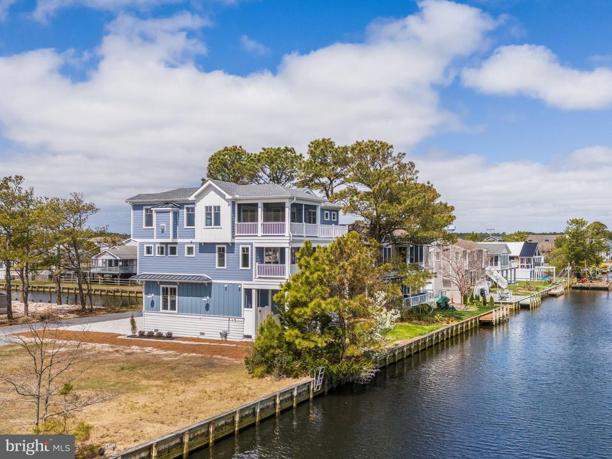 Rare Waterfront Opportunity on One of South Bethany’s Widest Canals with Dual Water Views and just .5 mile to Beach Access.

Welcome to this premier waterfront offering in the heart of South Bethany, nestled within the highly sought-after York Beach community. Perfectly positioned on a quiet cul-de-sac along one of the widest canals in the area, this brand-new custom residence captures expansive water views, including rare canal views from both the front and rear of the home—an increasingly hard-to-find setting in today’s market.

Executed to a level of quality and craftsmanship that stands apart from typical new construction, this home reflects a true commitment to detail, design, and long-term value.

Just a short 0.5-mile stroll to the beach, this home offers a unique combination of wide canal frontage and easy ocean access—a rare pairing that defines coastal living at its finest. Conveniently located just minutes from Indian River Marina at Delaware Seashore State Park, offering direct access to Indian River Bay and the Atlantic Ocean.

Spanning approximately 3,700 square feet, the home features an inverted floor plan designed to maximize natural light and water views throughout, along with a versatile layout ideal for multi-generational living. Each level includes its own dedicated living space, complete with a private beverage station and laundry—providing comfort, convenience, and independence for family and guests, all easily accessible via a private elevator servicing every floor.

At the heart of the home, the gourmet kitchen is equipped with premium Thermador appliances, a spacious island with built-in microwave, custom cabinetry with panel-ready appliances, quartz countertops, task lighting, and a pantry, along with direct access to the elevated rear deck overlooking the canal.

From here, the screened porch transitions seamlessly into the dining area and opens to the great room, creating a natural flow designed for both everyday living and effortless entertaining. The great room is enhanced by vaulted ceilings with wood beams, a custom beverage station styled with a glass tile backsplash and white oak shelving, a gas fireplace, and a nearby powder room.

Multiple indoor and outdoor living areas—including a second-level lounge with covered deck—provide flexible spaces to gather, relax, and take in the tranquil waterfront setting. This area also offers the option to be easily enclosed with the addition of a small wall, creating a potential fifth bedroom and further enhancing the home’s versatility.

Additional highlights include dual garages and energy-efficient construction with enhanced structural features. Tankless water heaters are located in an elevated, conditioned storage area within the garage for protection from humidity, and the home is built to meet current coastal construction standards.

This is a rare opportunity to own a custom-built waterfront retreat that combines wide canal frontage, dual water views, proximity to the beach, and a versatile layout—offering a level of quality, flexibility, and lifestyle that is not easily replicated in South Bethany.

For added peace of mind, the builder is offering a 2-10 Home Buyers Warranty. A full list of builder specifications is available, including energy-efficient construction materials and enhanced protection from the elements. All furnishings shown are virtually staged.