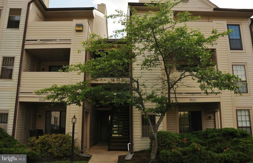 Walk to the pool & sports courts from this fantastic ground lvl condo w/ lake views! This home features beautiful wood floors thru out, spacious living rm w/ wood-burning fireplace, sizeable bedroom has a walk-in closet, kitchen with plenty of cabinet & counter space, updated bath, private patio & new W/D! Great location walk to shops & restaurants, close to Metro, commuter routes & Ft Belvoir!