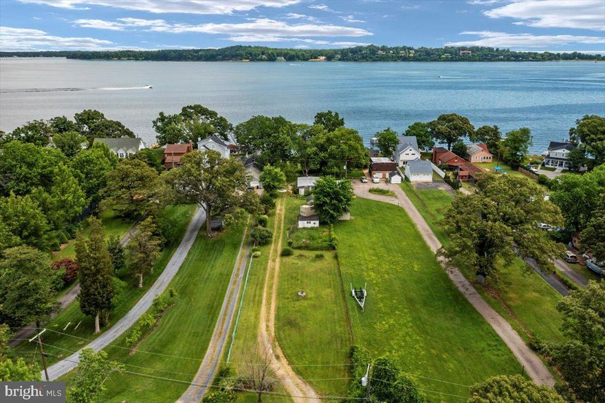 Elevated lot with expansive beautiful views overlooking the Magothy River, Gibson Island, Chesapeake Bay and Baltimore lighthouse,  is the perfect place to build your dream home. Small home is existing that can be torn down and used to avoid impact fees to the county, buyer to verify with county. Health department has evaluated and new septic system is permissible, Listing agent has documentation. 4 foot MLW is the average. You have to see the views to envision your new home. Well and private septic.