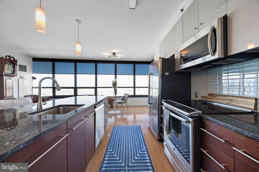Welcome to Residence 2001 at the highly sought-after Murano Condominium, located at 2101 Market Street—where luxury, convenience, and city living come together seamlessly. This rare and spacious one-bedroom, one-and-a-half-bath residence offers an expansive 1,091 square feet of well-designed living space, highlighted by its desirable north-facing exposure and breathtaking city views.

Upon entering, you are greeted by an open-concept layout featuring floor-to-ceiling windows that flood the space with natural light while showcasing the skyline. The generous living and dining area provides the perfect setting for both everyday living and entertaining. The modern kitchen is equipped with sleek cabinetry, premium appliances, and ample counter space, ideal for any home chef.

The oversized primary suite offers a peaceful retreat, complete with a luxurious en-suite bathroom and abundant closet space. A convenient half bath adds functionality for guests, enhancing the thoughtful layout of the home.

This residence is inclusive of an assigned parking space and a deeded storage locker—an exceptional value and rare offering within the building.

Residents of the Murano enjoy full-service amenities including a 24-hour concierge, state-of-the-art fitness center, indoor heated pool, sun deck, and more—all within steps of Rittenhouse Square, 30th Street Station, and some of Philadelphia’s finest dining, shopping, and cultural destinations.

A rare opportunity to own a premier one-bedroom residence in one of Center City’s most iconic buildings.

Please note: Photos are of a similar unit with the same layout and comparable finishes; they are for illustrative purposes only and may not reflect the exact unit.