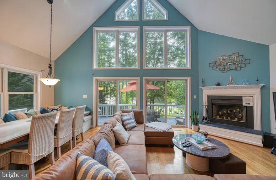 Get ready for lake life at “Switch Things Up” on the private side of Lake Anna! This waterfront retreat boasts 110 feet of shoreline, complete with a single-slip boathouse featuring a boat lift and jet ski lift, a covered entertainment area, and a sandy beach perfect for swimming and kids at play.
The main level offers a spacious living and dining area with hardwood floors and a cozy wood-burning fireplace. The upgraded kitchen features granite countertops, stainless steel appliances, and a breakfast bar. This level also includes one bedroom and a full bathroom, with access to a large lakeside deck ideal for outdoor dining and relaxing with family and friends.
Upstairs, you’ll find a beautifully updated full bathroom with double vanities, a walk-in shower, and a jetted tub. The primary suite features a private lakeside balcony and a walk-in closet. Two additional bedrooms are located on the upper level, one with its own half bath.
The lower level includes an additional bedroom, full bathroom, and a spacious family room with a wet bar, perfect for entertaining. The oversized garage has been converted into a fun game room space. A large, level front yard provides plenty of room for outdoor games and gatherings.
Furniture conveys, making this property truly turn-key. Whether you're looking for a weekend getaway or a full-time residence, this lakefront gem offers abundant space, comfort, and outdoor living. Don’t miss this opportunity to own your slice of Lake Anna!