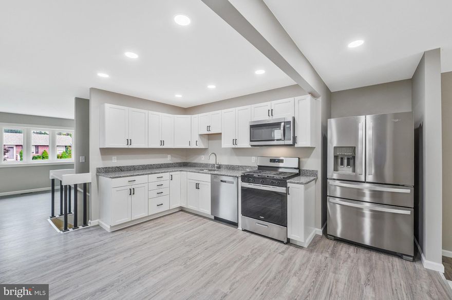 Everything in this house is new!! New vinyl siding! All new kitchen cabinets and appliances!  All new sub floor and new luxury vinyl flooring through out!  All new bathroom, new tub, new sink and toilet!!  New windows!  New deck and side porch! New hot water tank! New HVAC! New doors and closet doors in all bedrooms!  Addition off the kitchen! Could be large dining room or 1st floor family room with French doors to new deck! Come and view you dream home.